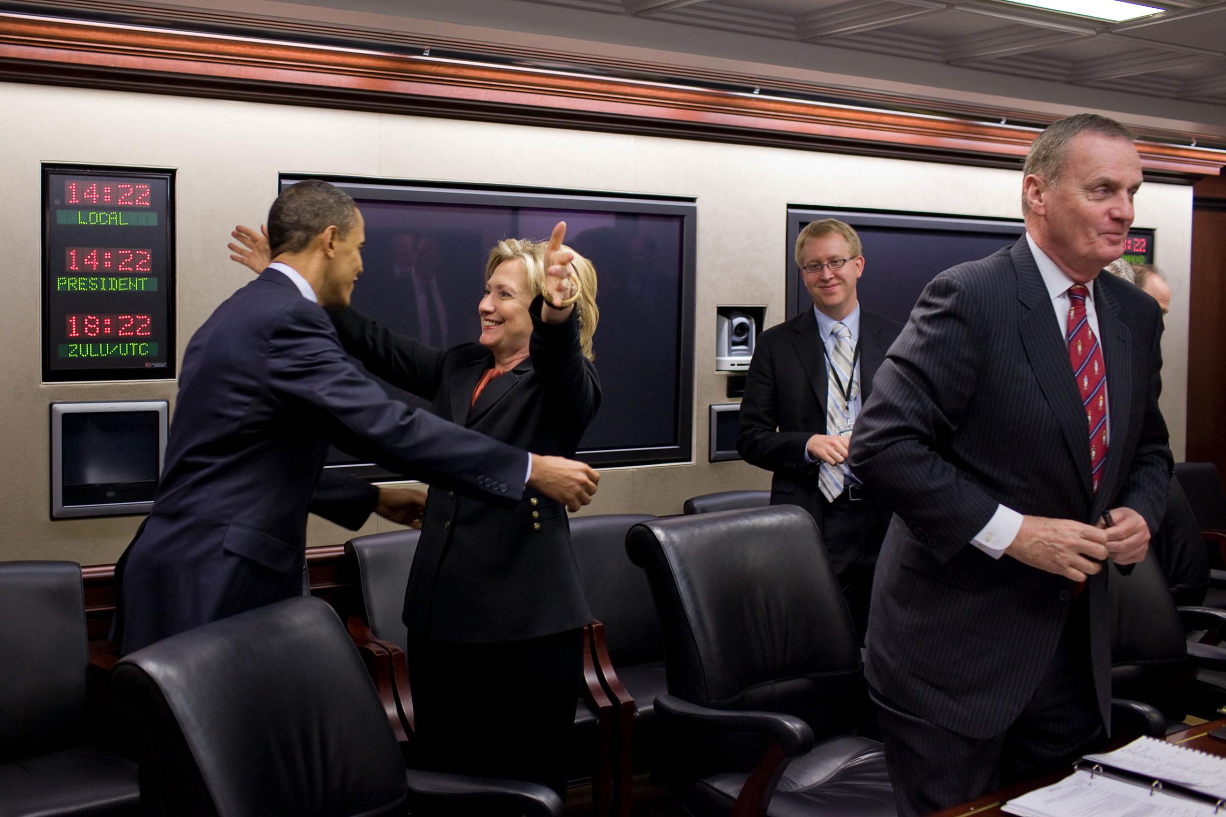 Secretary of State Hillary Rodham Clinton congratulates President Barack Obama on the House vote to pass health care reform, prior to a meeting in the Situation Room of the White House, March 22, 2010.