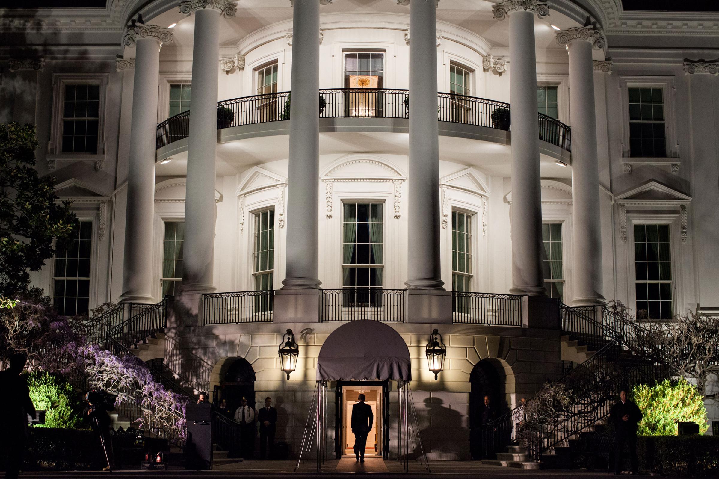President Obama enters the White House at the South Portico following his arrival aboard Marine One on the South Lawn, March 30, 2012. The President returned from a trip to Vermont and Maine.
