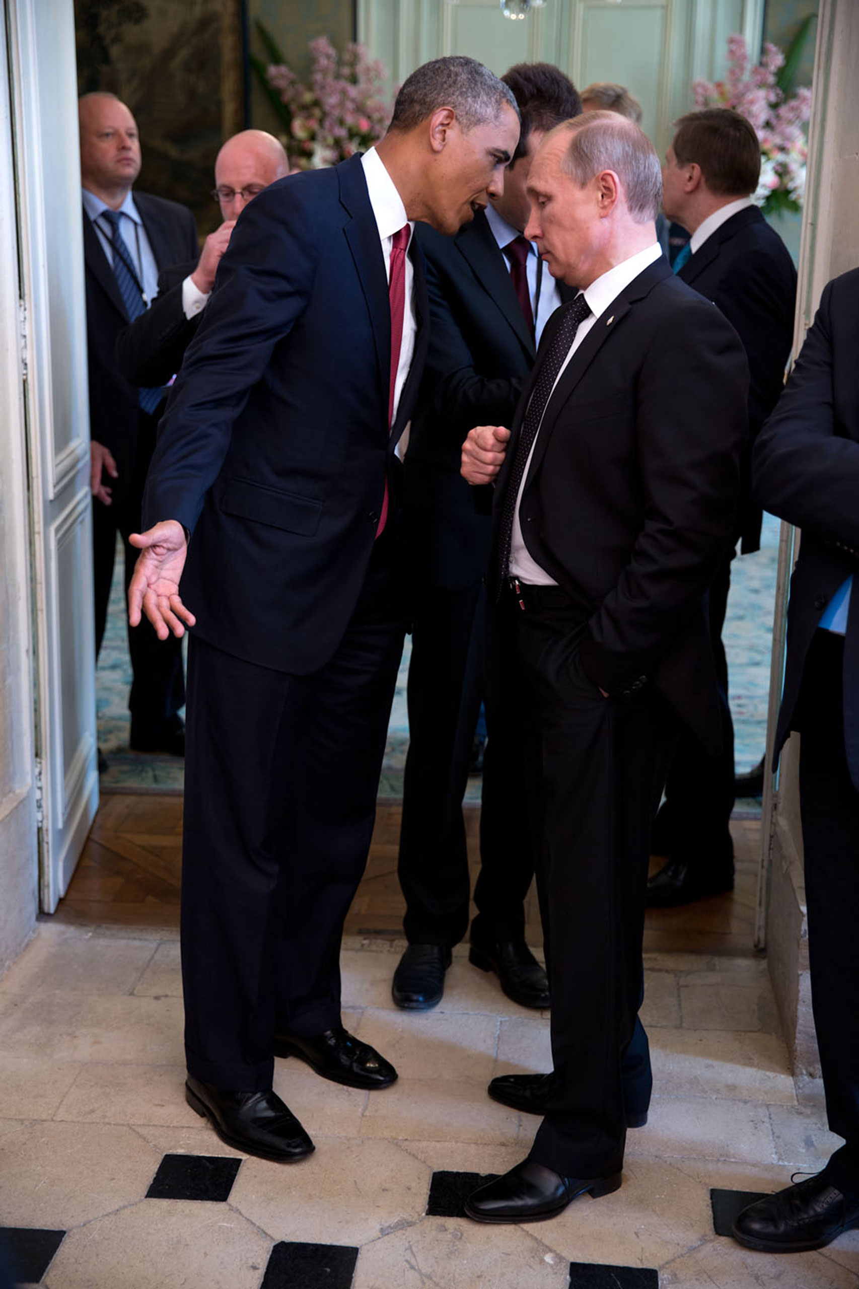 The President talks with Russian President Vladimir Putin after a lunch with other foreign leaders to commemorate the 70th anniversary of D-Day in Normandy, France. I'm sure they were talking about a subject matter other than D-Day,  June 6, 2014.