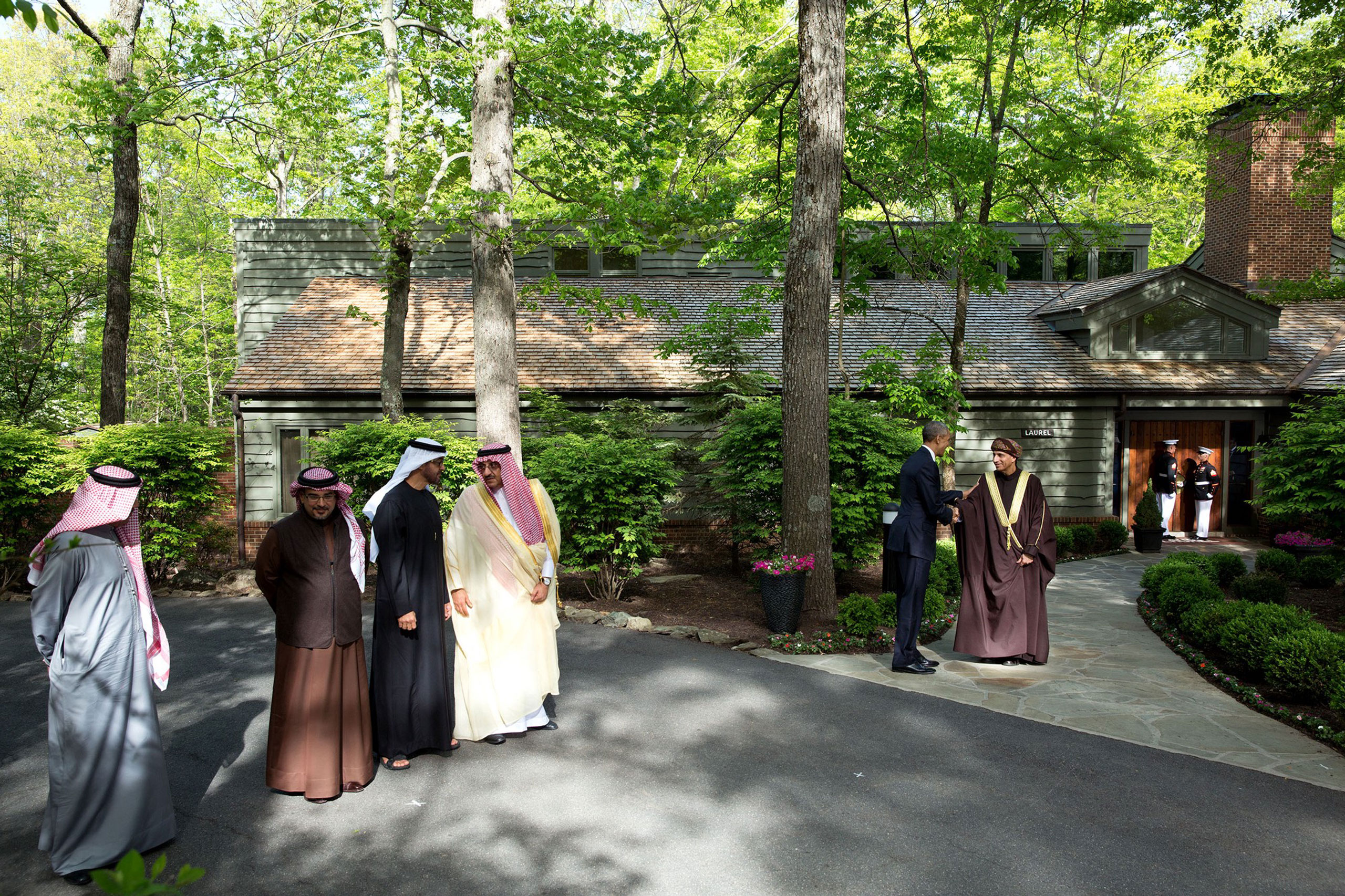 The President had hosted a summit meeting at Camp David with the Gulf Cooperation Council. At the conclusion of the summit, each of the leaders was introduced before a final group photo in front of Laurel Cabin. Rather than shoot a tight shot of each leader, I used a wide angle lens to show more of the atmosphere of Camp David. Here, the President greets Sayyid Fahd bin Mahmoud al Said, Deputy Prime Minister for the Council of Ministers’ Affairs of the Sultanate of Oman,  May 14, 2015.