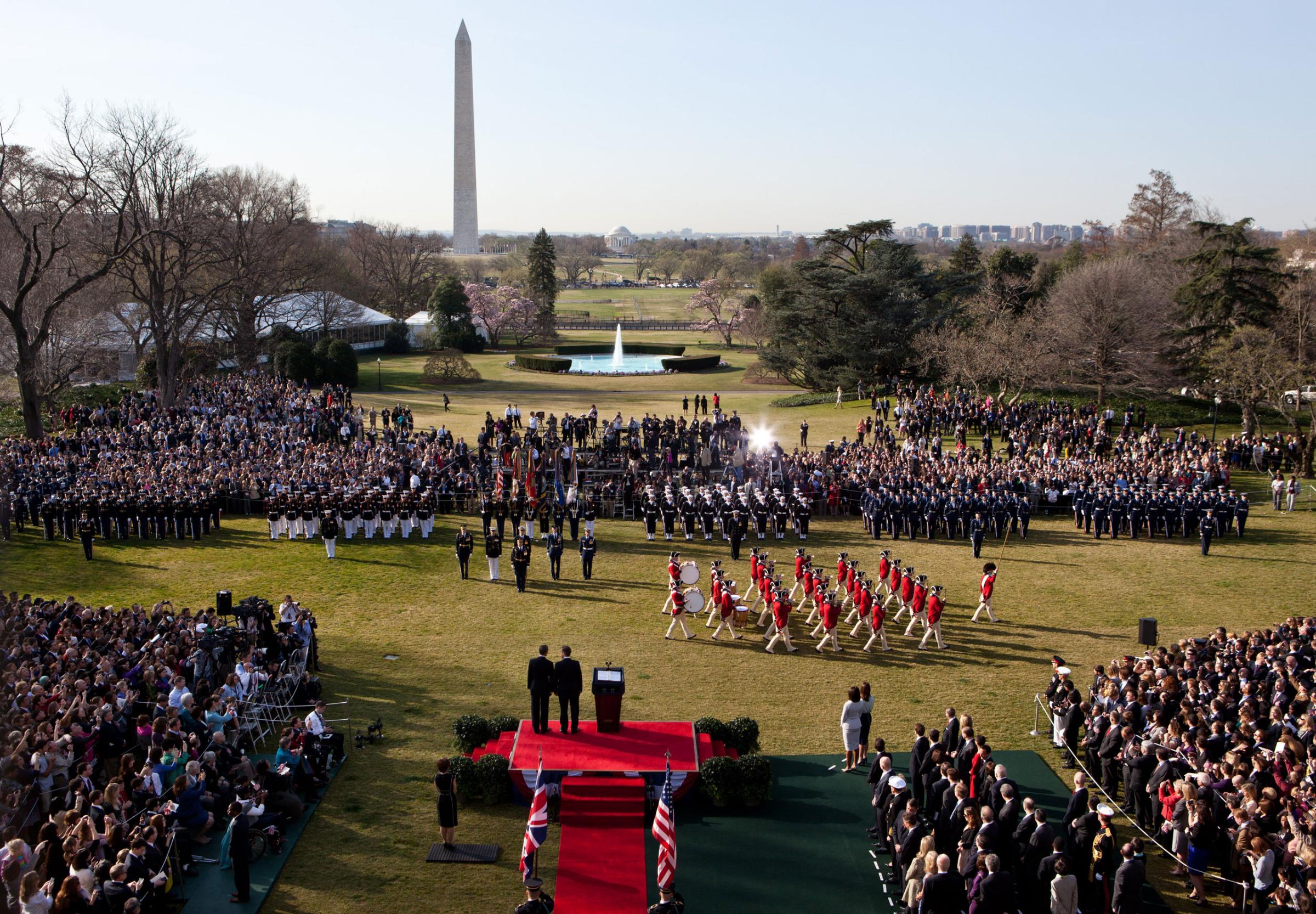President Barack Obama and Prime Minister David Cameron of the United Kingdom watch the U.S. Army Fife and Drum Corps pass during the Official Arrival Ceremony on the South Lawn, March 14, 2012