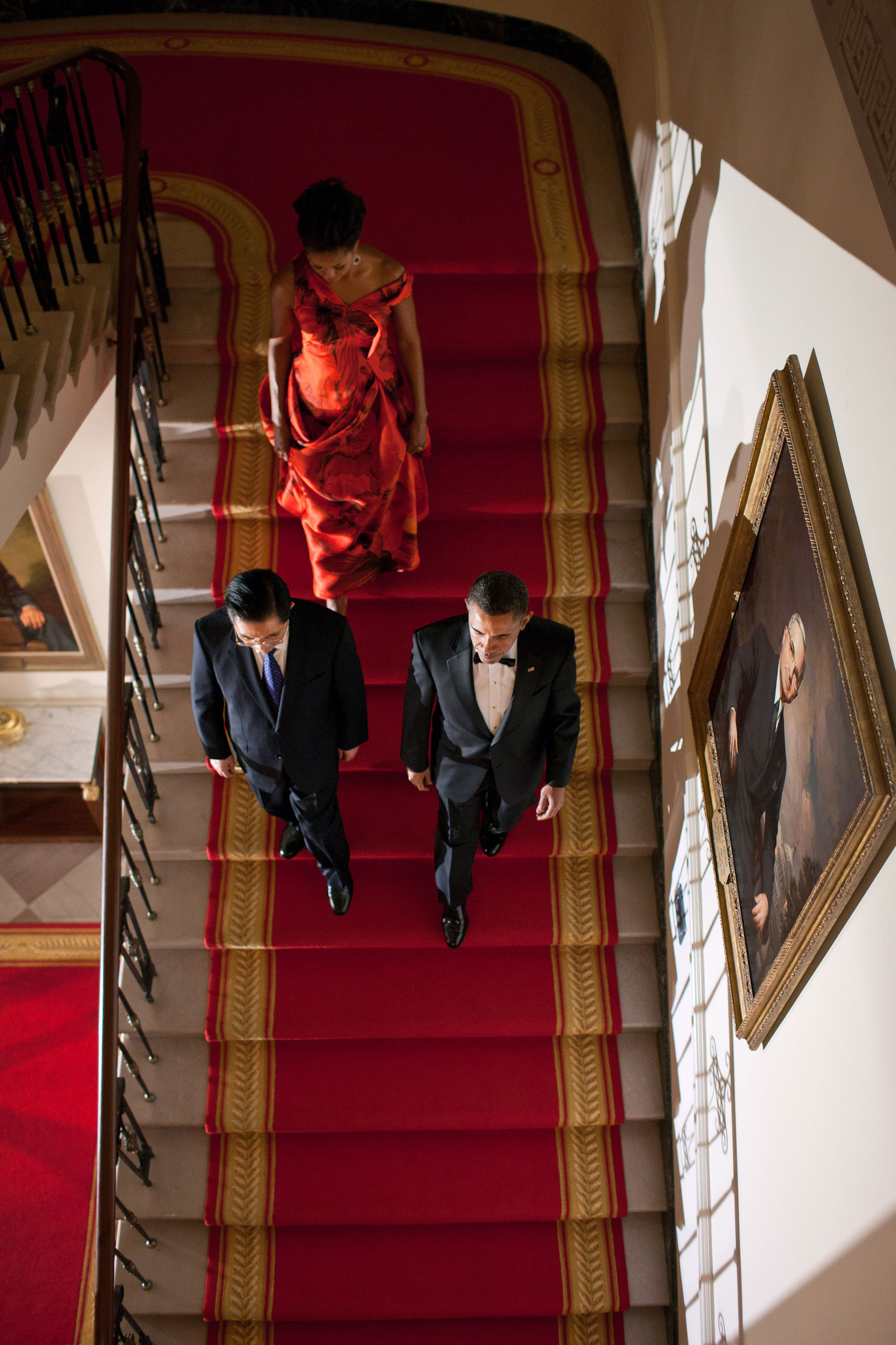 The President, the First Lady and President Hu Jintao of China descend the Grand Staircase of the White House before a formal State Dinner, Jan. 19, 2011.