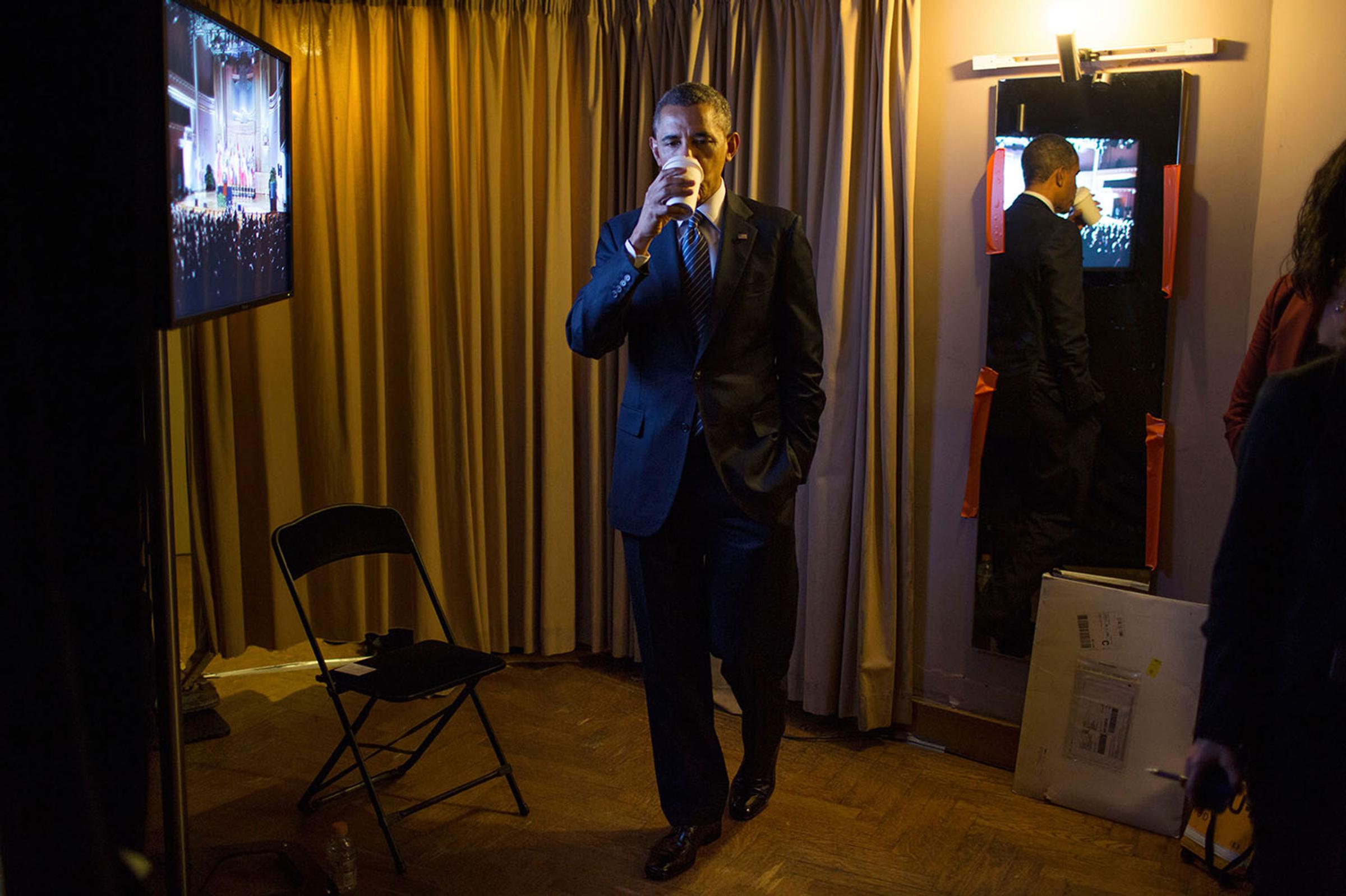 President Barack Obama sips hot tea backstage before he delivers remarks at the Palais Des Beaux Arts in Brussels, Belgium, March 26, 2014.