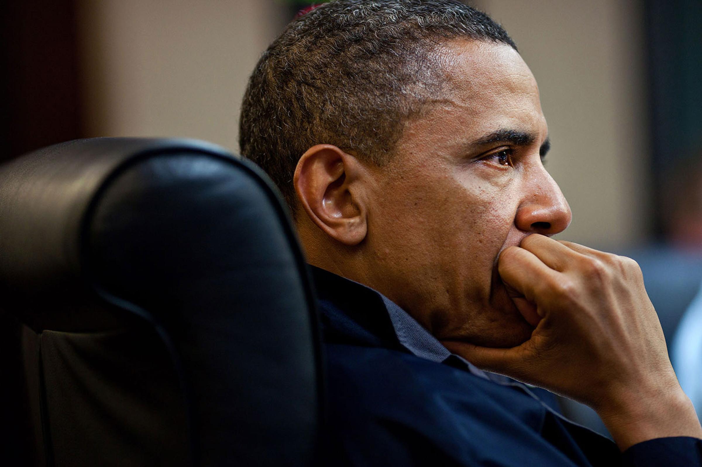 President Barack Obama listens during one in a series of meetings discussing the mission against Osama bin Laden, in the Situation Room of the White House, May 1, 2011.
