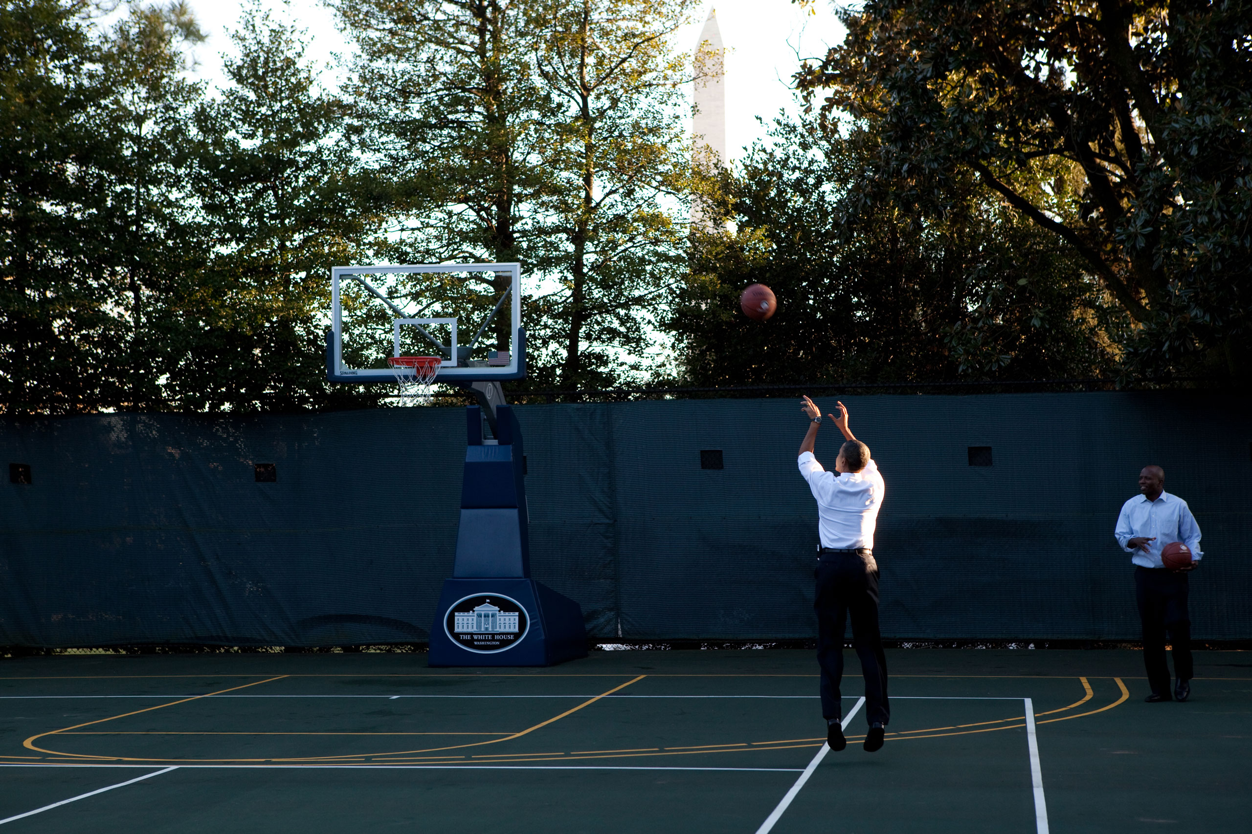 President Barack Obama shoots hoops with his personal aide, Reggie Love, at the White House basketball court, Jan. 18, 2010.