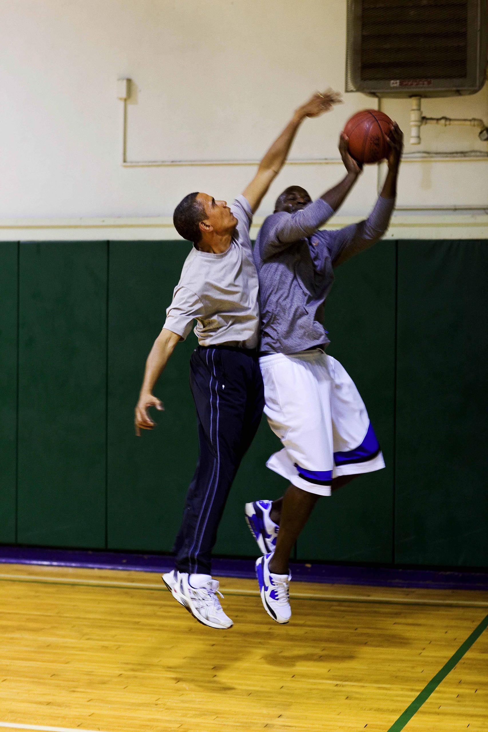 President Barack Obama blocks a shot while playing basketball with personal aide Reggie Love at St Bartholomew's Church in New York City, where the President is attending the United Nations General Assembly, Sept. 23, 2009. (Official White House photo by Pete Souza)This official White House photograph is being made available only for publication by news organizations and/or for personal use printing by the subject(s) of the photograph. The photograph may not be manipulated in any way and may not be used in commercial or political materials, advertisements, emails, products, promotions that in any way suggests approval or endorsement of the President, the First Family, or the White House.