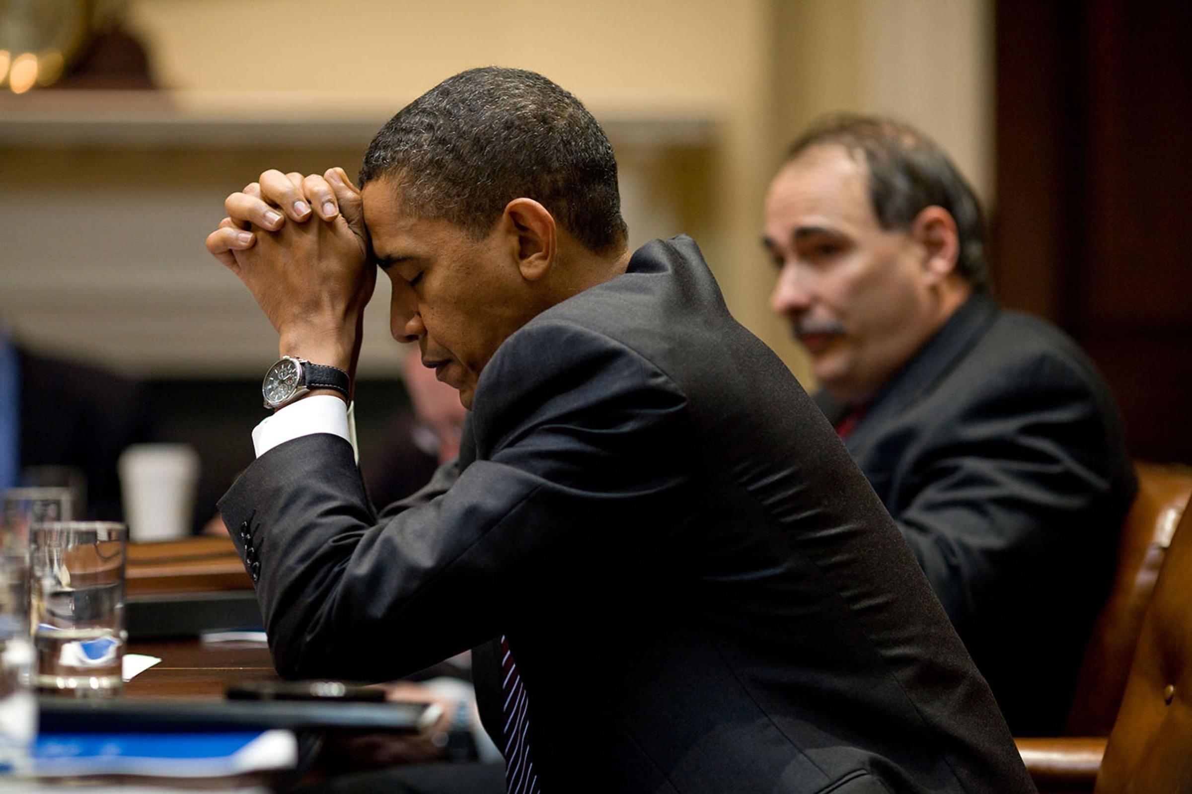 “The President appears in deep thought as he and senior advisor David Axelrod listen during a climate change meeting in the Roosevelt Room of the White House. A moment later, he was laughing at a humorous exchange,”Oct. 14, 2009.