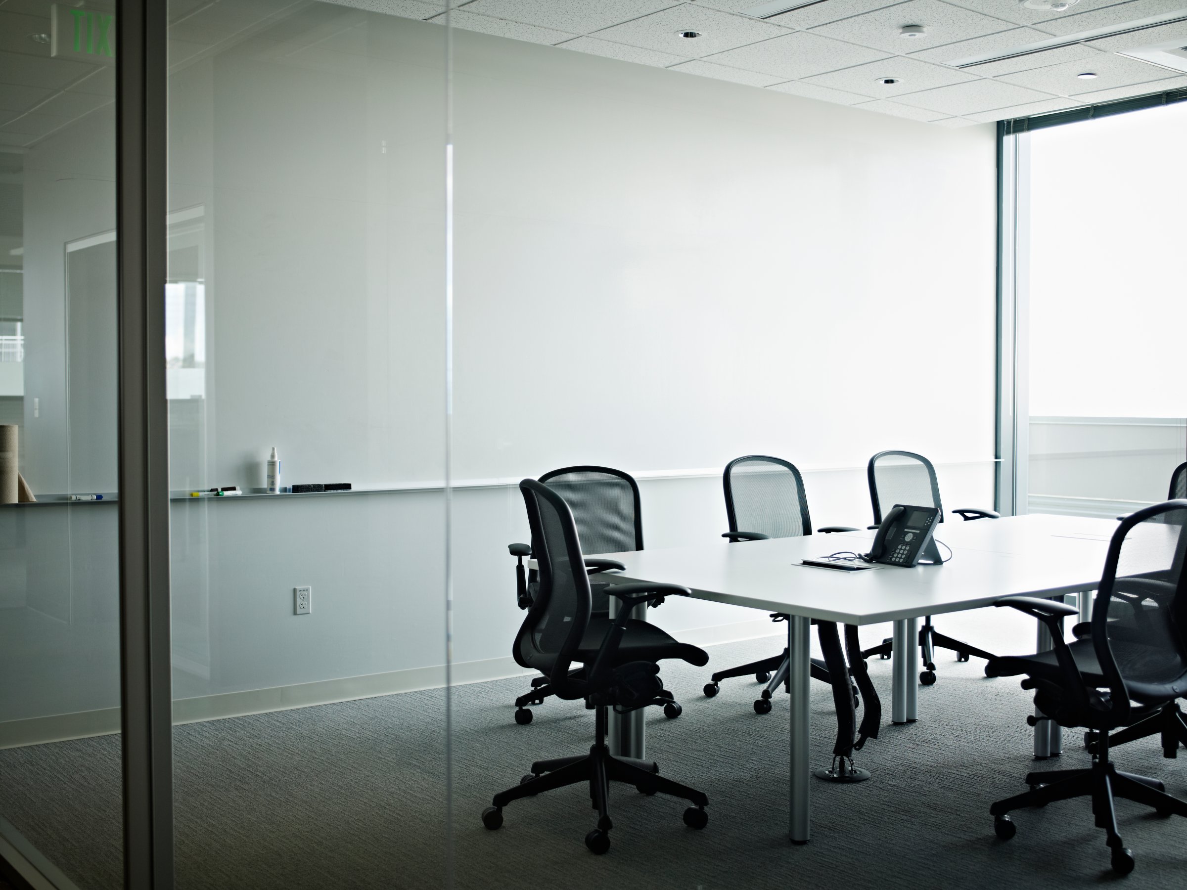Empty office conference room with phone on table