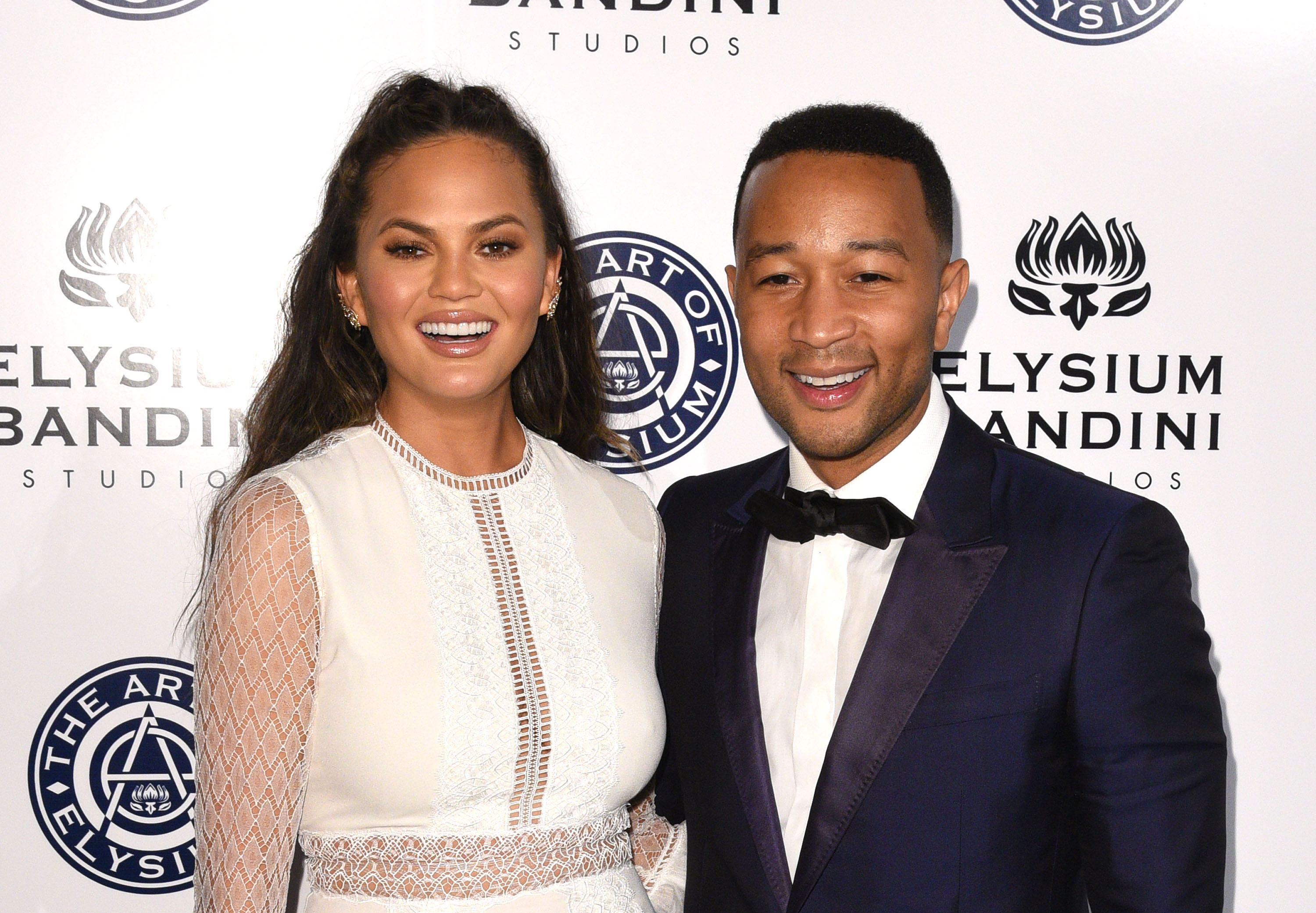 Model Chrissy Teigen (L) and recording artist John Legend attend The Art of Elysium presents Stevie Wonder's HEAVEN - Celebrating the 10th Anniversary at Red Studios on January 7, 2017 in Los Angeles, California. (C Flanigan—Getty Images)