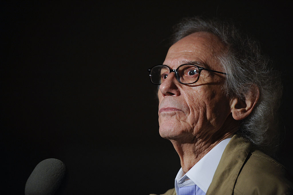 Artist Christo speaks at a press conference unveiling two original preparatory collages for 'Over The River' on Nov. 8, 2011 in Washington, DC. (Riccardo S. Savi&mdash;Getty Images)