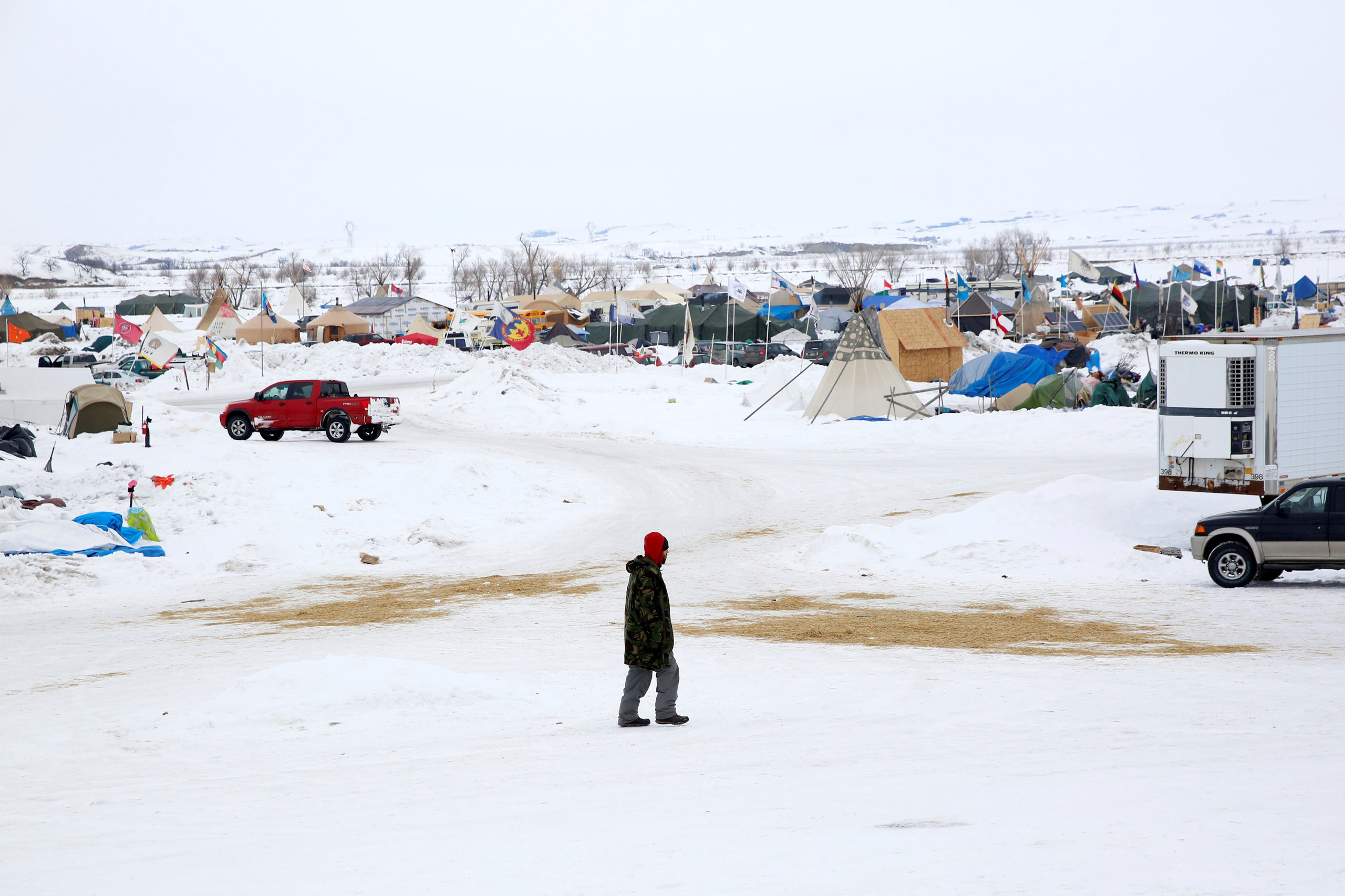 A man walks through the Dakota Access Pipeline protest camp on the edge of the Standing Rock Sioux Reservation near Cannon Ball, N.D., on Jan. 24, 2017. (Terray Sylvester—Reuters)