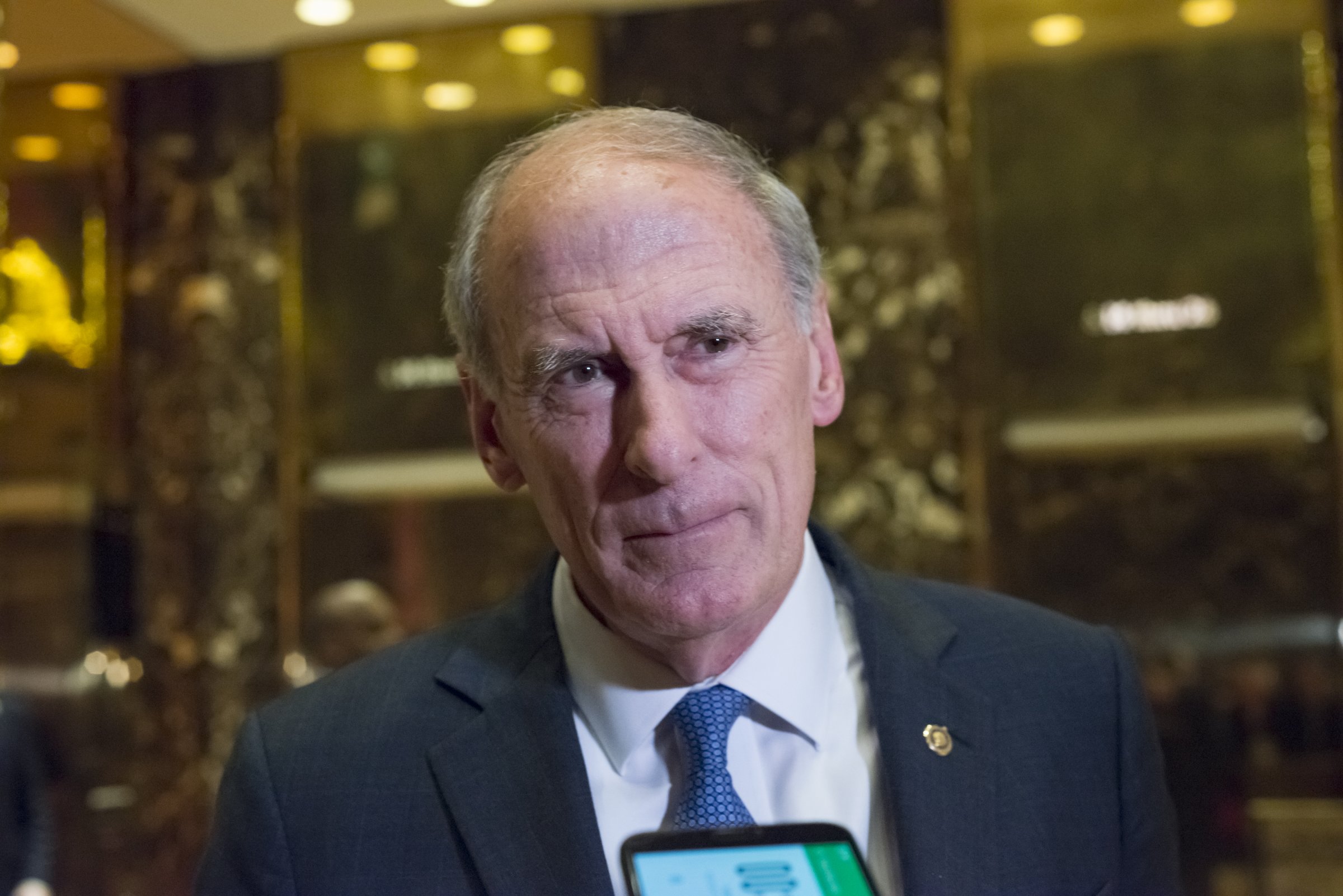 Senator Daniel Coats, a Republican from Indiana, pauses while speaking to the media in the lobby of Trump Tower in New York, U.S., on Wednesday, Nov. 30, 2016.