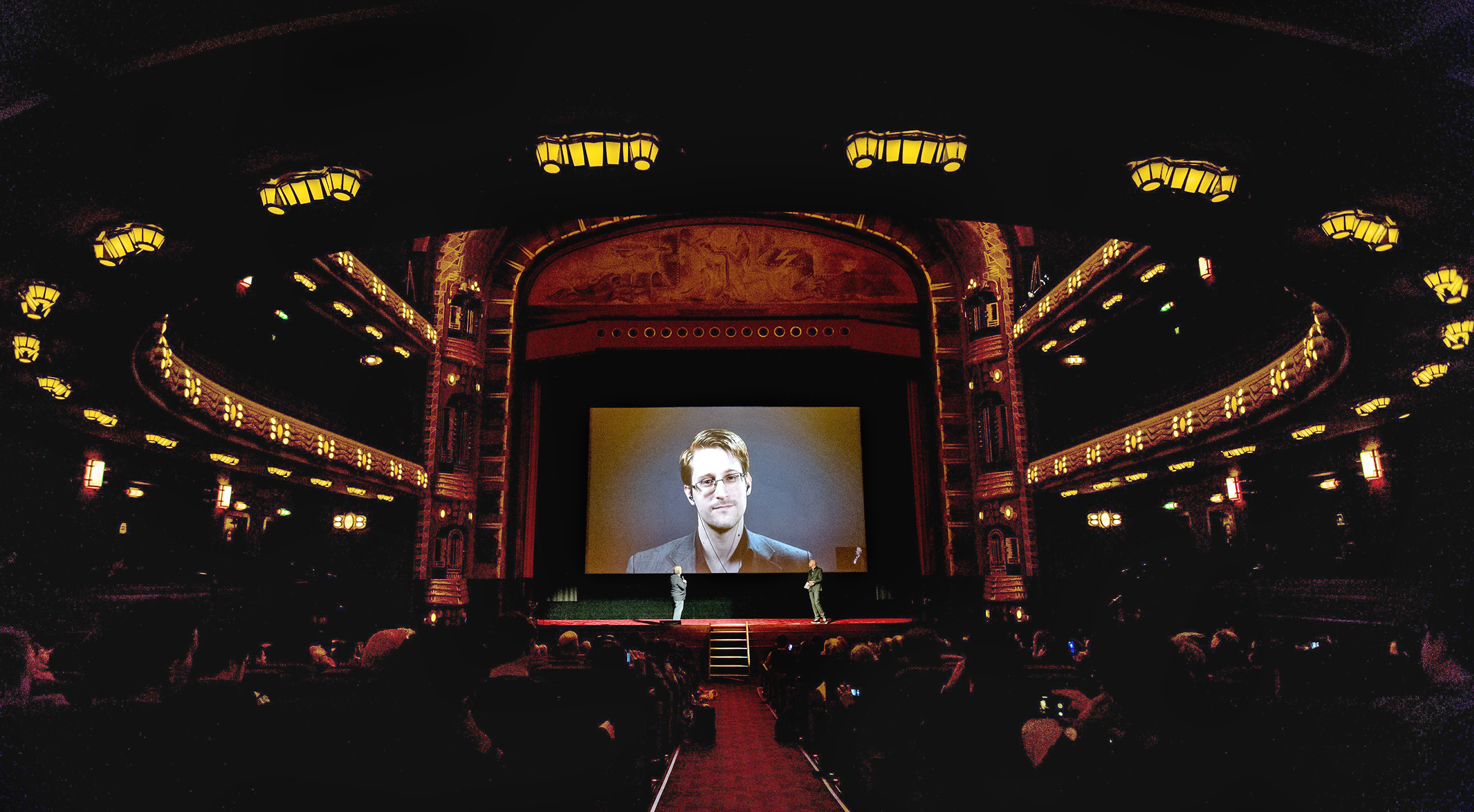 Snowden can still appear outside Russia—as at this Amsterdam film festival—but only by video link (Sander Koning—AFP/Getty Images)