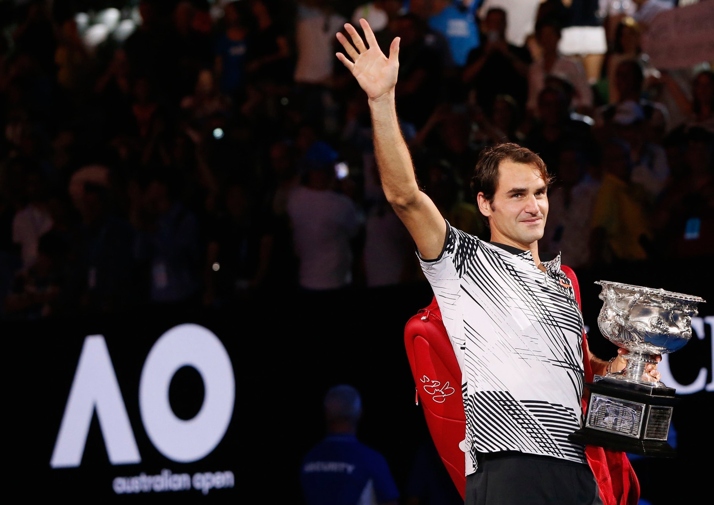 Tennis - Australian Open - Melbourne Park, Melbourne, Australia - 29/1/17 Switzerland's Roger Federer holds the trophy as he celebrates after winning his Men's singles final match against Spain's Rafael Nadal. REUTERS/Issei Kato TPX IMAGES OF THE DAY
