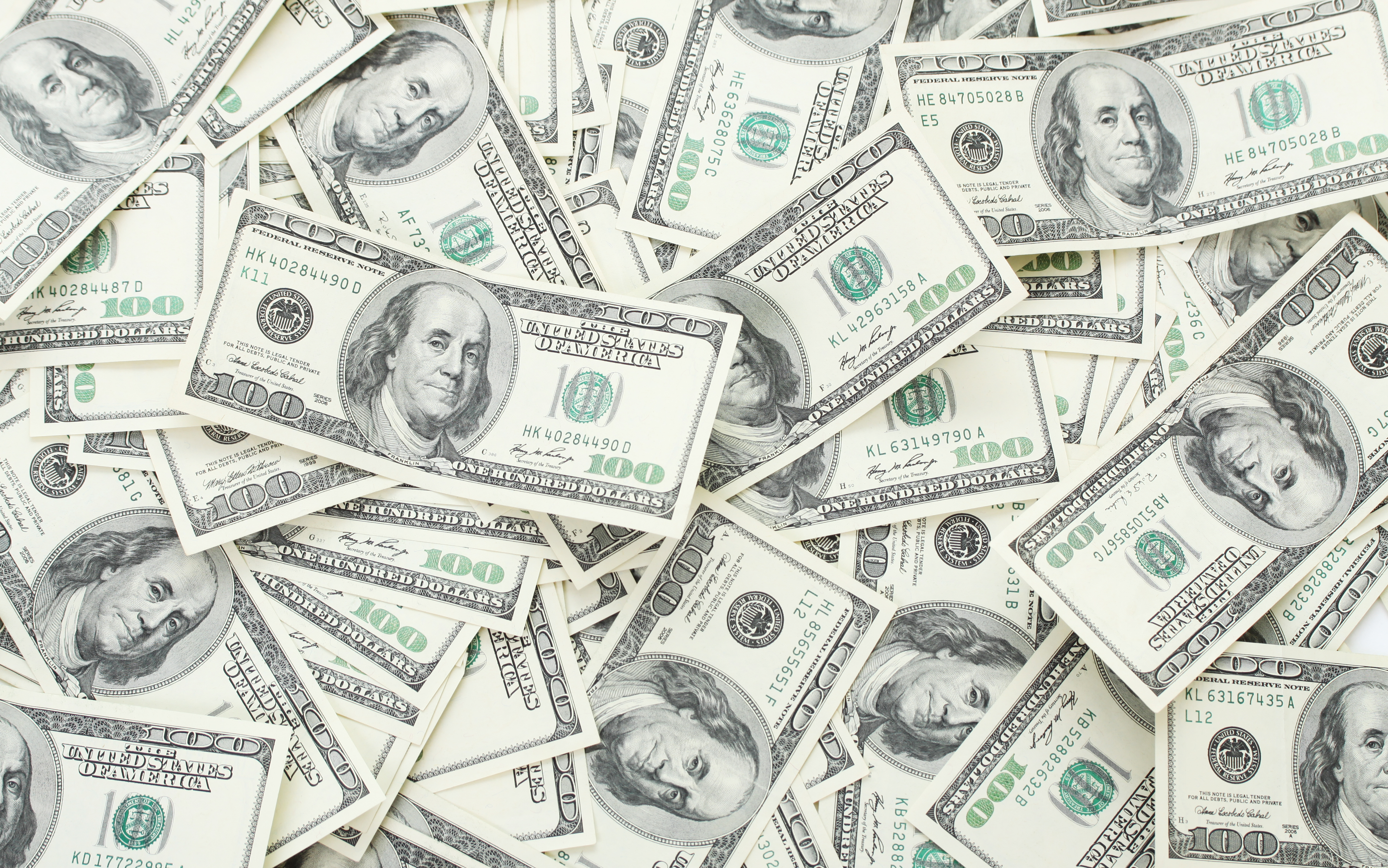 Background with money american hundred dollar bills - horizontal (hynci—Getty Images/iStockphoto)