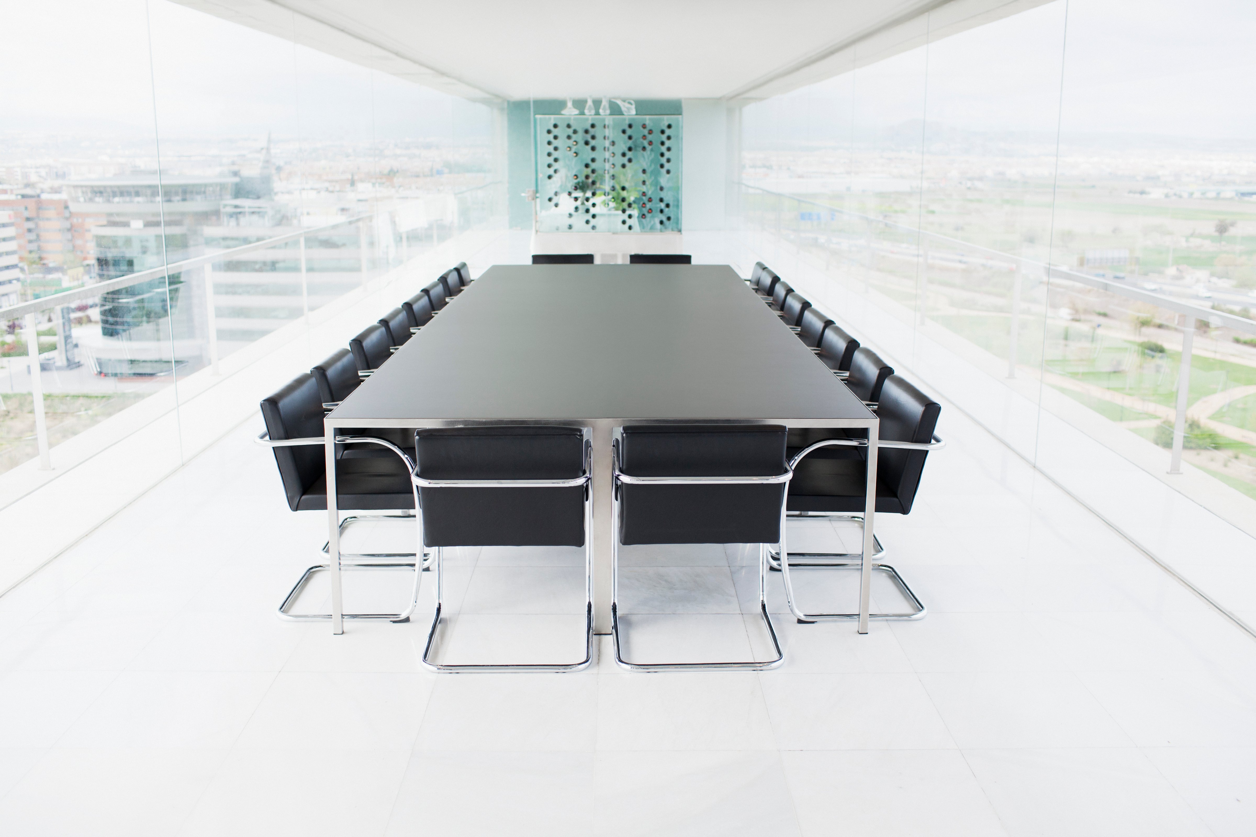 Empty conference room overlooking city (Martin Barraud—Getty Images/Caiaimage)