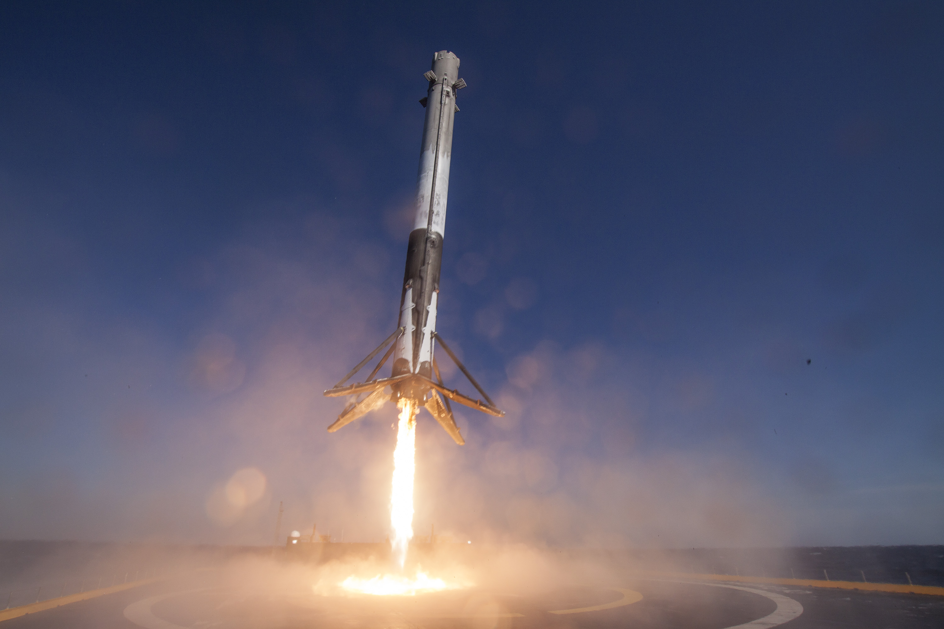 In this handout provided by the National Aeronautics and Space Administration (NASA), SpaceX's Falcon 9 rocket makes its first successful upright landing on the  Of Course I Still Love You  droneship on April 8, 2016 some 200 miles off shore in the Atlantic Ocean after launching from Cape Canaveral, Florida.
