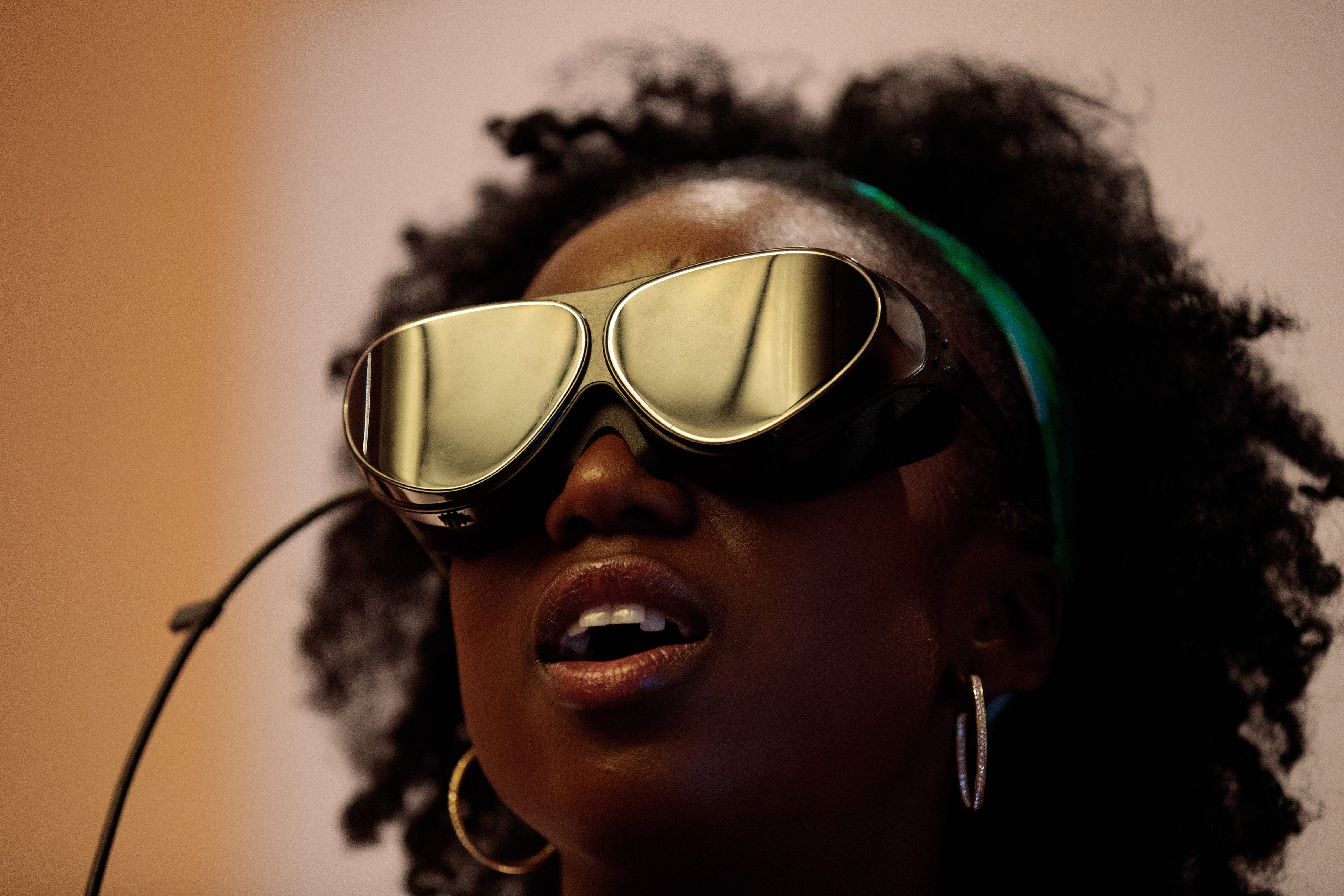 A woman tries on Dlodlo V1 VR glasses during a press preview for the glasses at the Marriott Marquis, August 8, 2016 in New York City. (Drew Angerer&mdash;Getty Images)