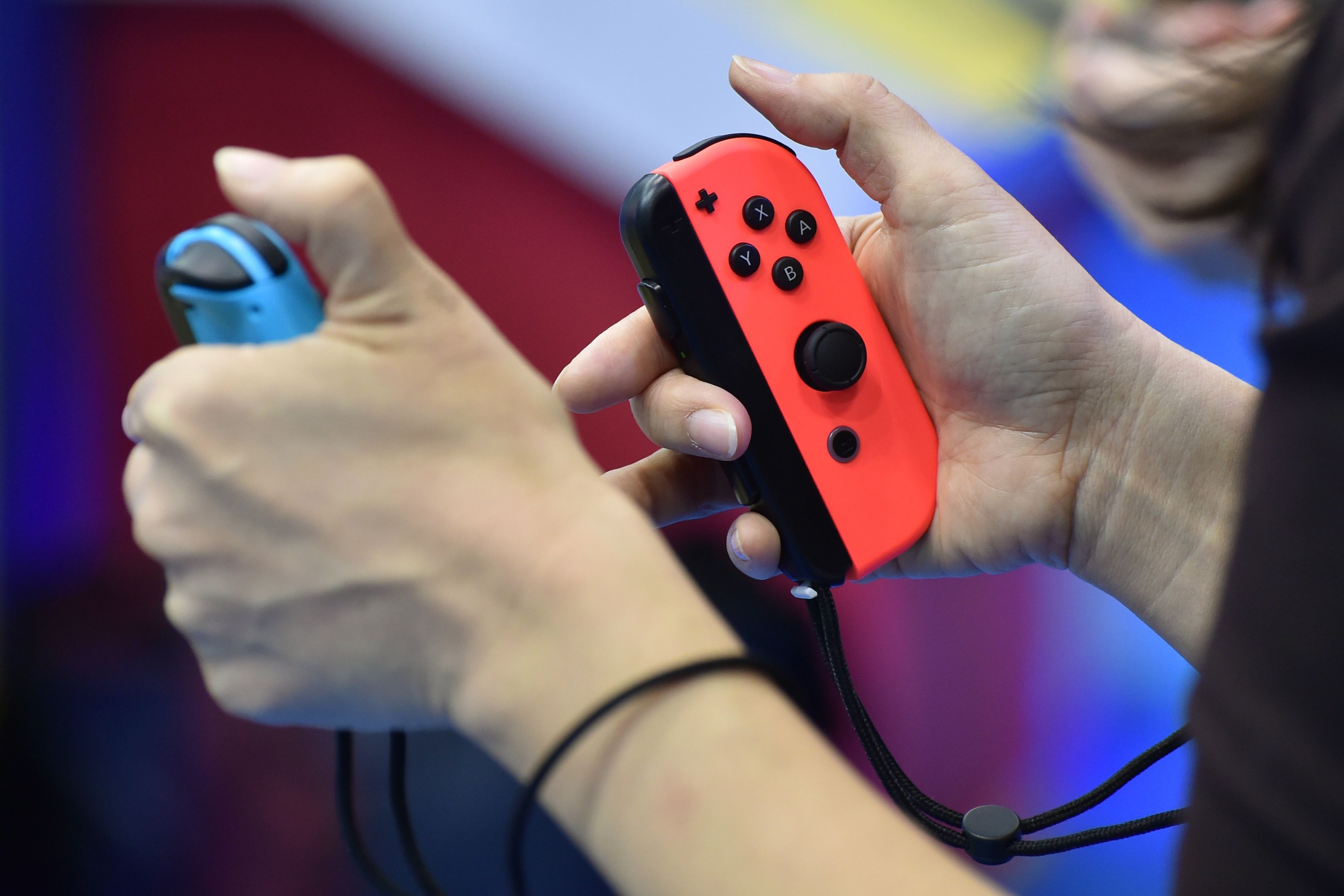 Visitors play Nintendo's new video game console Switch during its presentation in Tokyo on January 13, 2017. (Kazuhiro NogI—AFP/Getty Images)