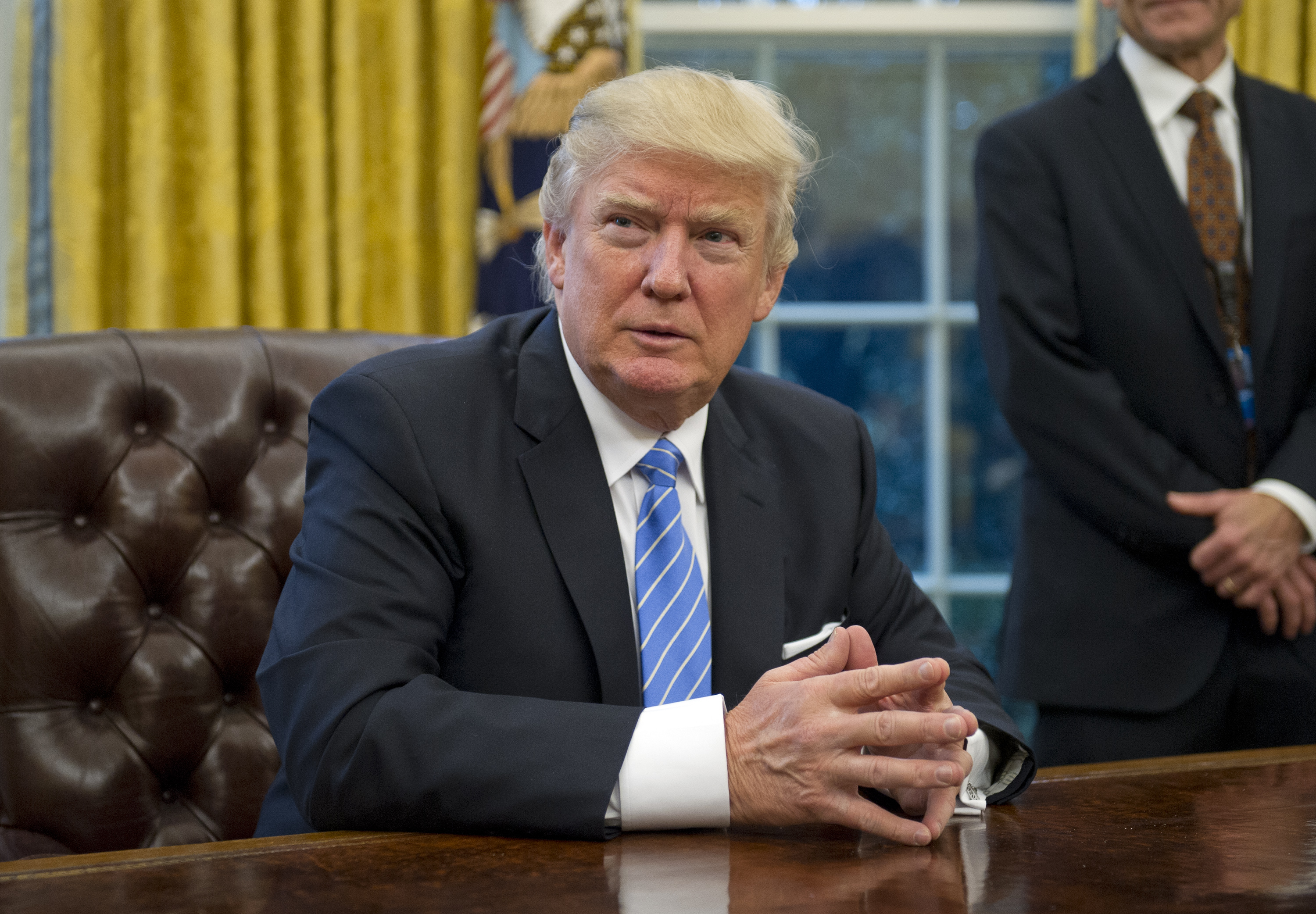 President Donald Trump in the Oval Office of the White House in Washington, D.C. on January 23, 2017. (Pool/Getty Images)
