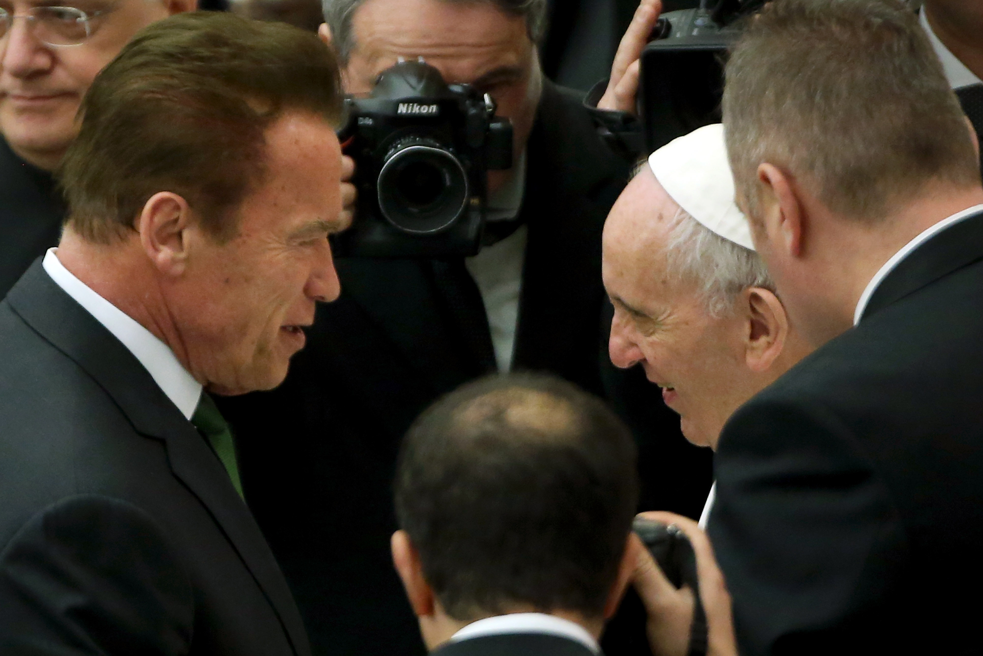 Pope Francis greets US actor and former governor of California Arnold Schwarzenegger during his weekly audience at the Paul VI Hall on Jan. 25, 2017 in Vatican City, Vatican. (Franco Origlia—Getty Images)