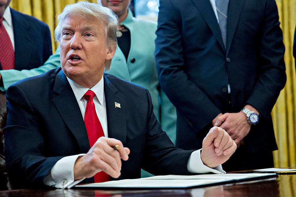 U.S. President Donald Trump speaks before signing an executive order surrounded by small business leaders in the Oval Office of the White House January 30, 2017 in Washington, DC. (Pool—Getty Images)