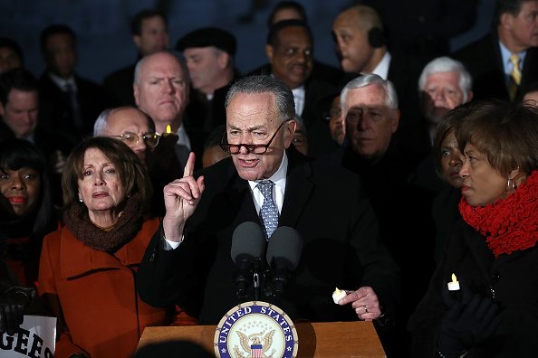 Senate Minority Leader Chuck Schumer (D-NY) and House Minority Leader Nancy Pelosi (D-CA) lead members of Congress during a protest on the steps of the U.S. Supreme Court January 30, 2017 in Washington, D.C.