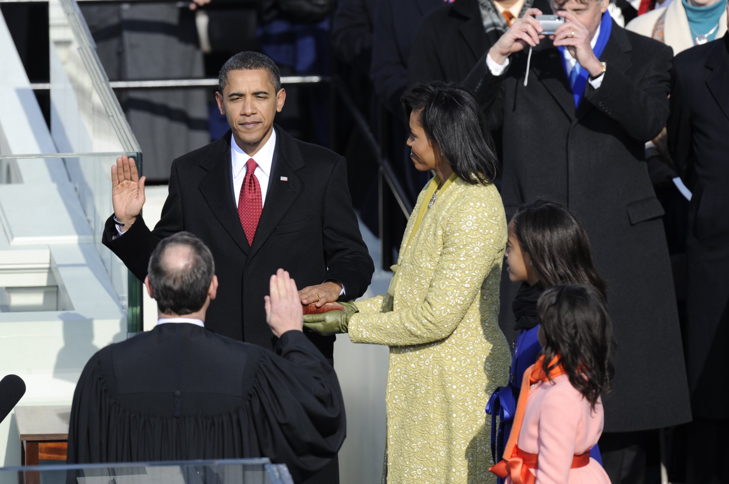 President Elect, Barack Obama, takes the Oath of Office from Chief Justice, Roberts as his wife, Michelle, and his daughters, Malia, and Sasha, far right, during the Presidential Inauguration at the U.S. Capitol Tuesday afternoon.