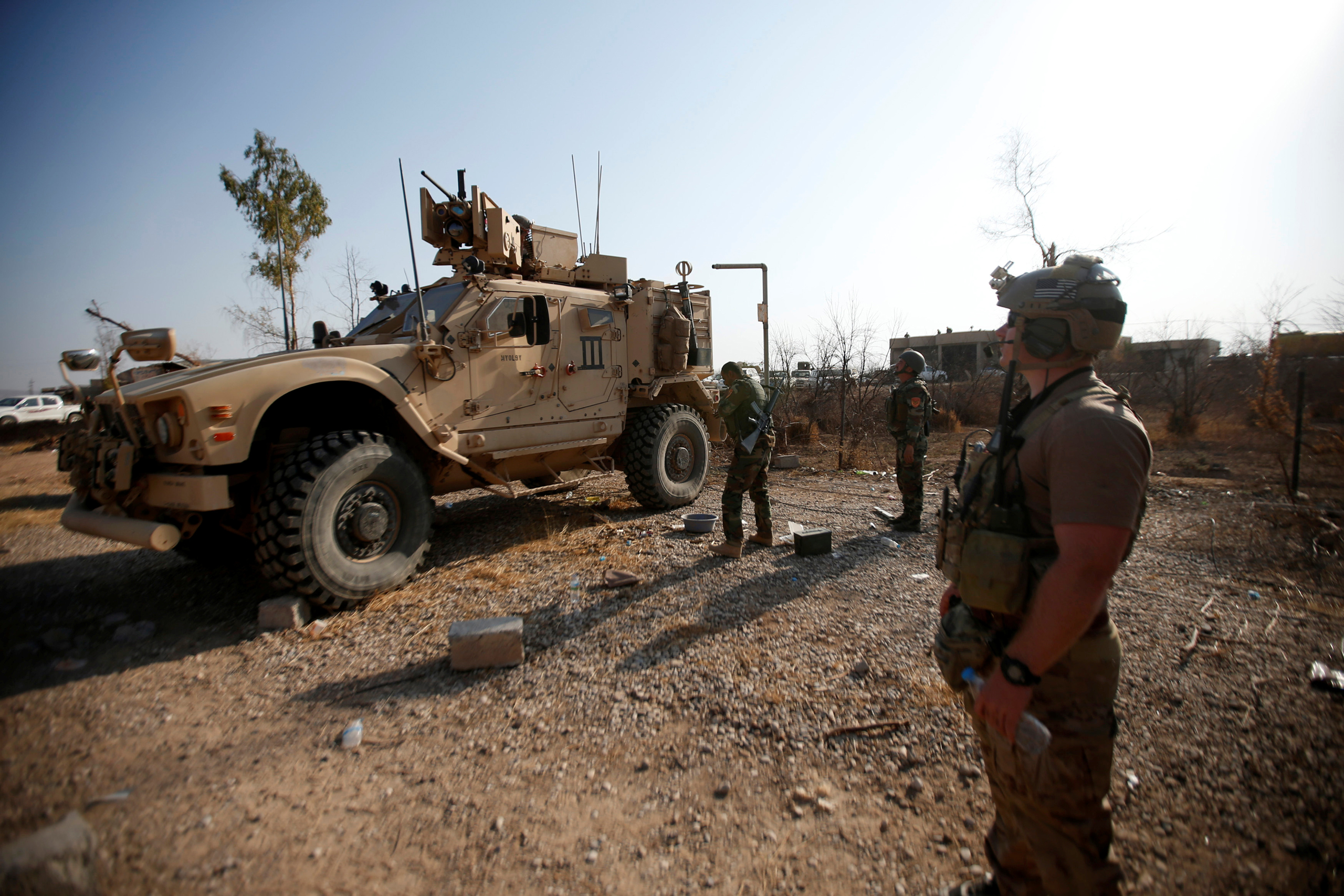 U.S. military vehicles are seen in the town of Bashiqa, east of Mosul