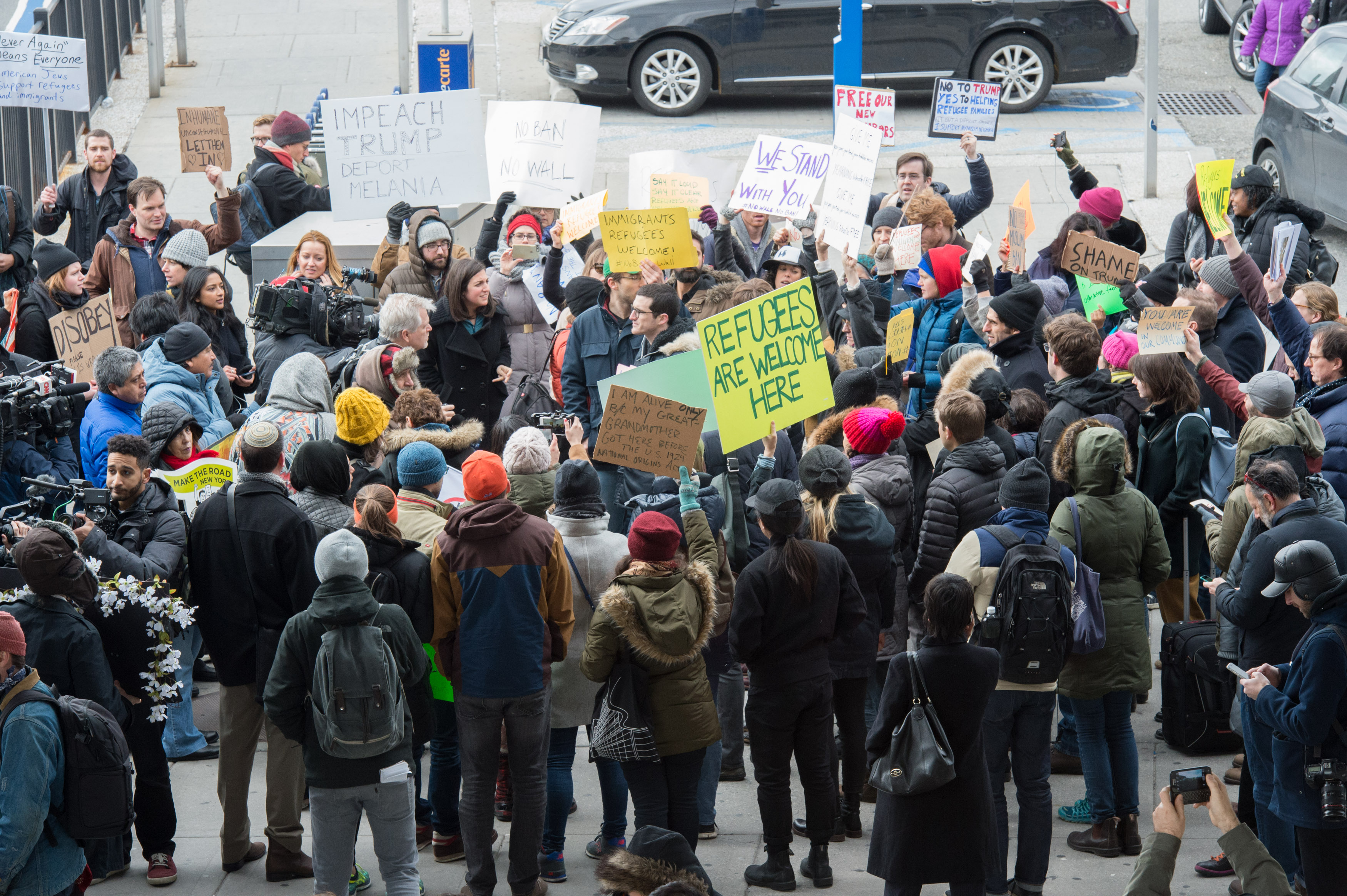 Protesters gather at JFK International Airport's Terminal 4 to demonstrate against Trump's executive order, on Jan. 28, 2016 in New York. (Bryan R. Smith—AFP/Getty Images)