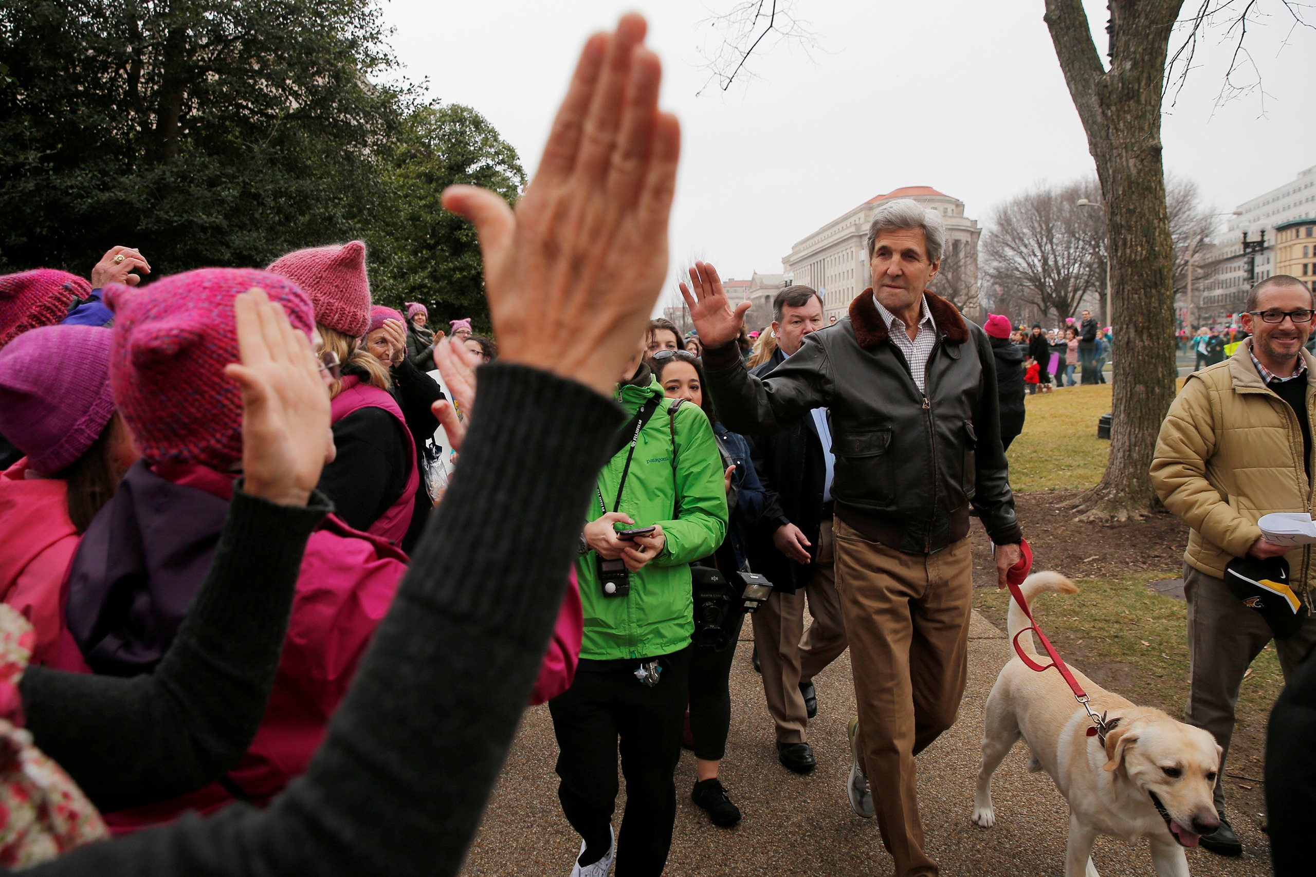 Former U.S. Secretary of State John Kerry walks his dog to join the Women's March on Washington, following the inauguration of U.S. President Donald Trump, on Jan. 21, 2017. (Brian Snyder—Reuters)