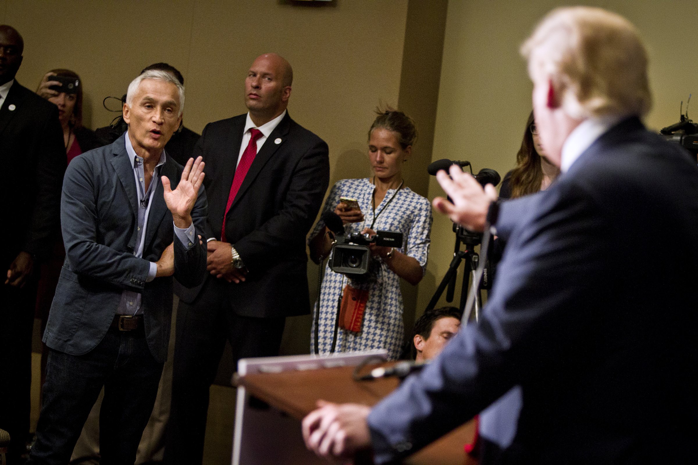 Republican presidential candidate Donald Trump spars with Univision reporter Jorge Ramos before his "Make America Great Again Rally" at the Grand River Center in Dubuque, Iowa, August 25, 2015. Ramos was removed from Trump's news conference on Tuesday after the Republican presidential candidate said the journalist was asking a question out of turn. REUTERS/Ben Brewer TPX IMAGES OF THE DAY - RTX1PNL1