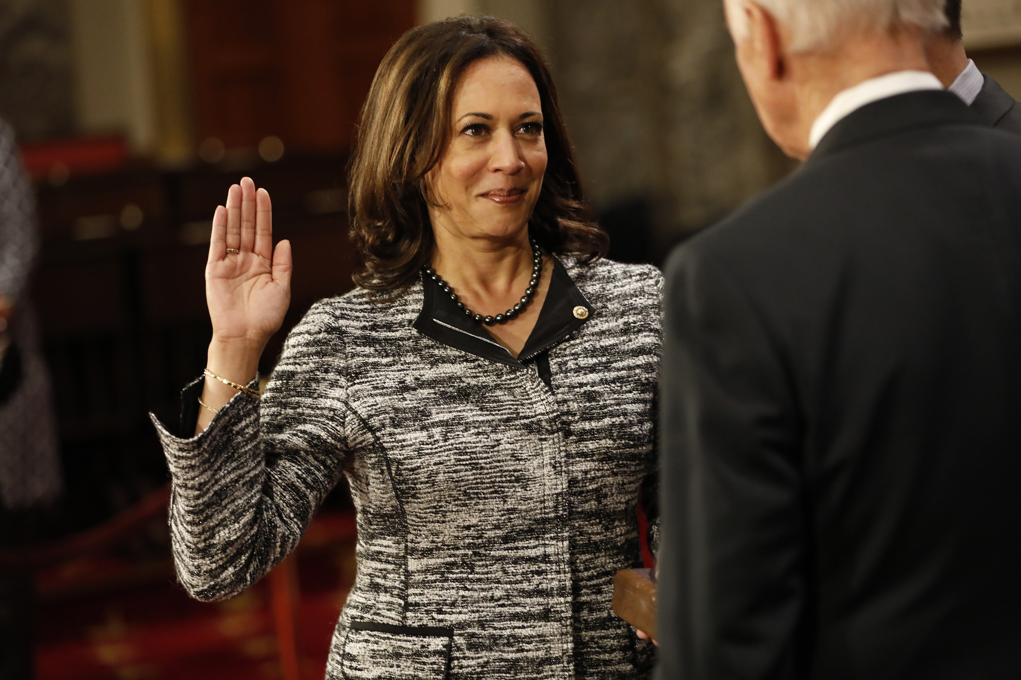 WASHINGTON, DC - JANUARY 3: U.S. Sen. Kamala Harris (D-CA) participates in a reenacted swearing-in with U.S. Vice President Joe Biden in the Old Senate Chamber at the U.S. Capitol January 3, 2017 in Washington, DC. Earlier in the day Biden swore in the newly elected and returning members on the Senate floor. (Photo by Aaron P. Bernstein/Getty Images) (Aaron P. Bernstein/Getty Images)