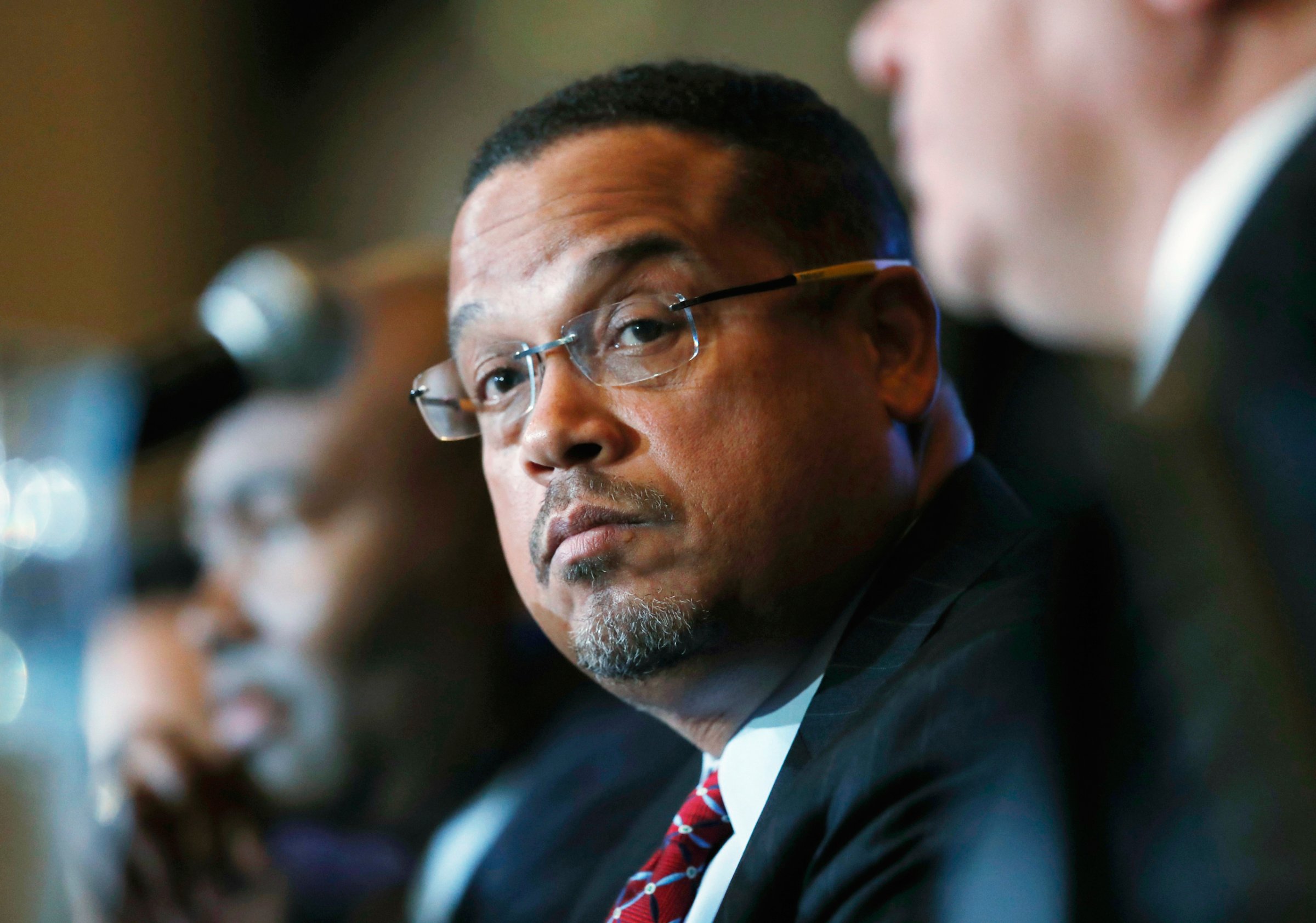 FILE - In this Dec. 2, 2016 file photo, U.S. Rep. Keith Ellison, D-Minn., listens during a forum on the future of the Democratic Party, in Denver. Ellison, who is currently running to be the next chair of the Democratic National Committee, announced Monday, Jan. 16, 2017, he is boycotting Donald Trump's presidential inauguration on Friday. (AP Photo/David Zalubowski, File)