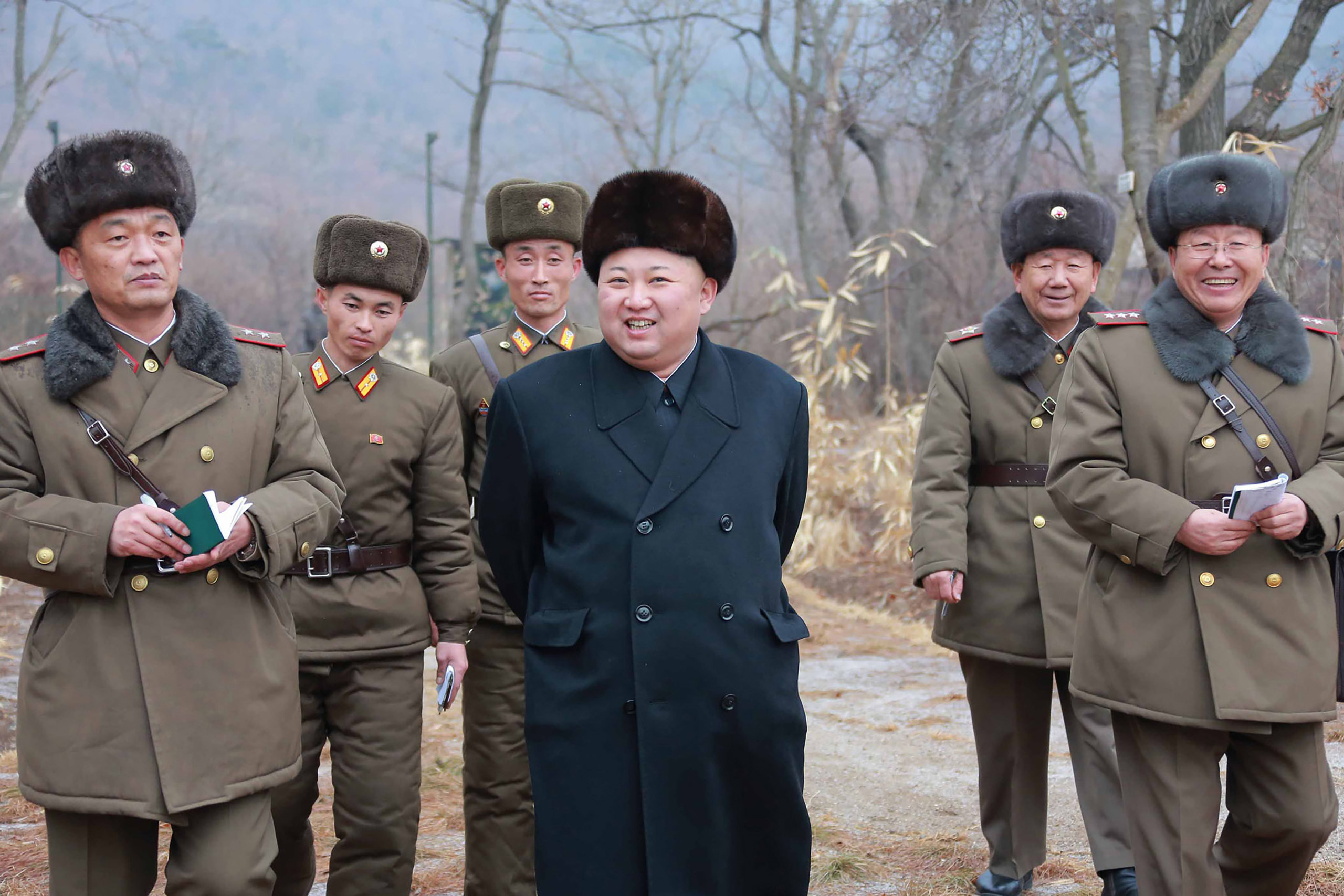 This undated picture released from North Korea's official Korean Central News Agency (KCNA) on Jan. 19, 2017 shows North Korean leader Kim Jong-Un (C) inspecting a sub-unit under KPA Unit 233 at an undisclosed location. (STR—AFP/Getty Images)