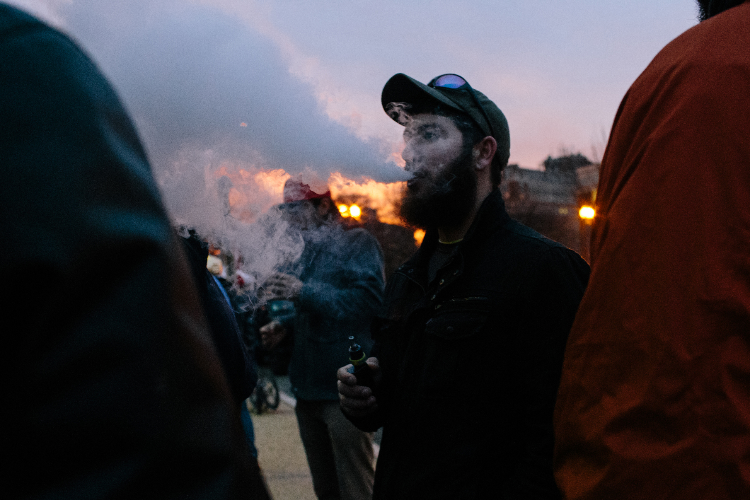 Alex Rider, 29, from Brunswick, Md., smokes a vaporizer while he waits to receive a free joint at the #Trump420 event on Jan. 20, 2017 in Washington.