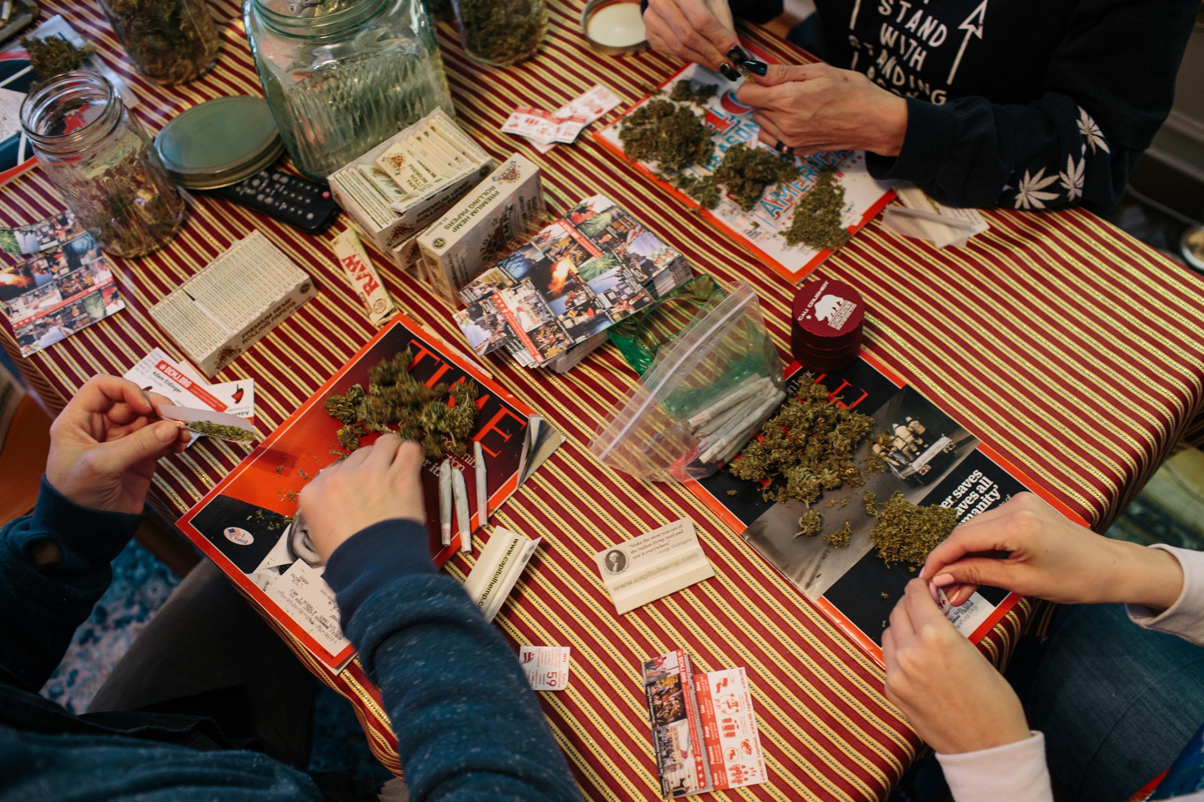 Activists from the cannabis community DCMJ roll joints in a Washington, D.C., home on Jan. 16 in preparation for President-Elect Donald Trump’s inauguration. A cofounder of the group said TIME magazines were used after learning a photographer on assignment for TIME would observe their operations. Other newspapers and magazines, like High Times, have previously been used when the group has been photographed by other media.