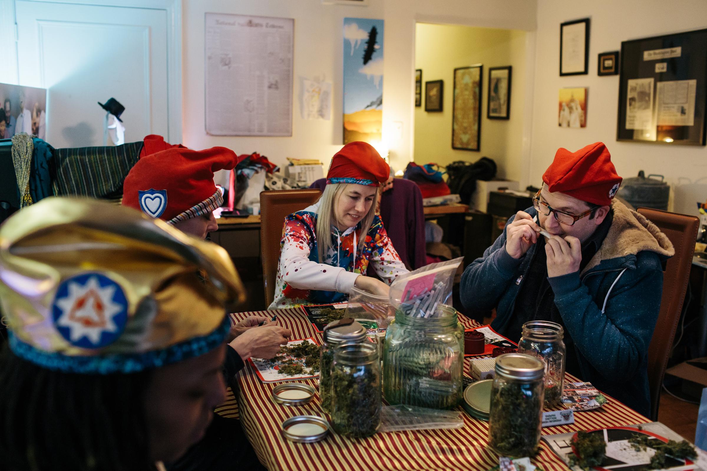 Adam Eidinger, of the cannabis community DCMJ, rolls a joint in a Washington, D.C., home on Jan. 16. The group will distribute thousands of joints before President-Elect Donald Trump's inauguration.