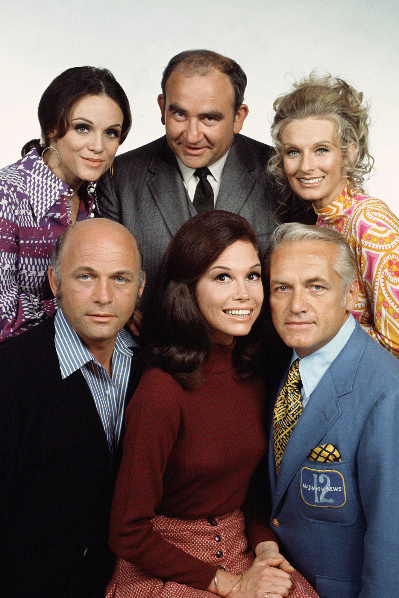 Clockwise from top left: Valerie Harper, Ed Asner, Cloris Leachman, Ted Knight, Mary Tyler Moore and Gavin MacLeod in a promo image from The Mary Tyler Moore Show in 1972.