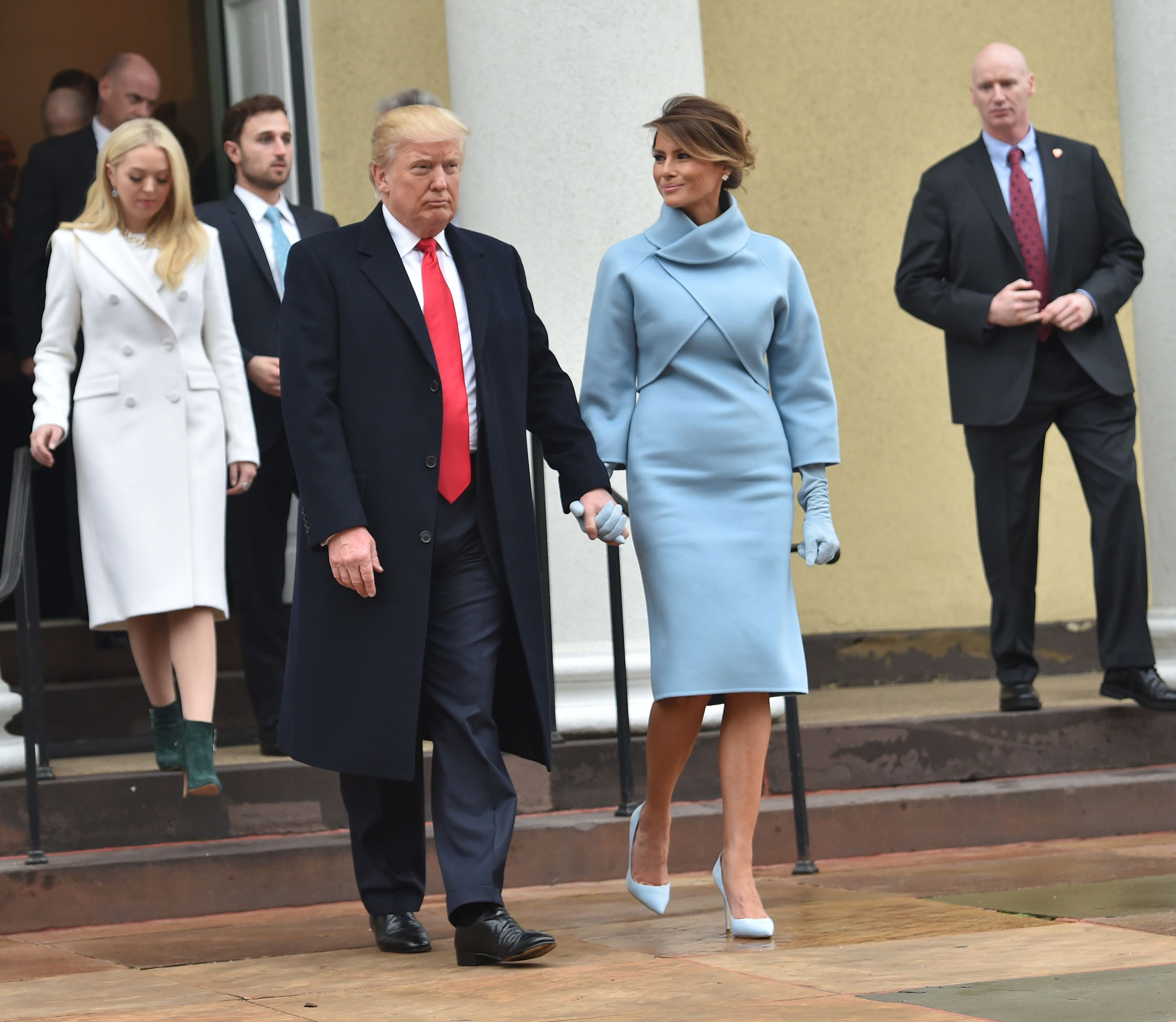 US President-elect Donald Trump and his wife Melania leave St. John's Episcopal Church on Jan. 20, 2017, before Trump's inauguration. (Nicholas Kamm—AFP/Getty Images)