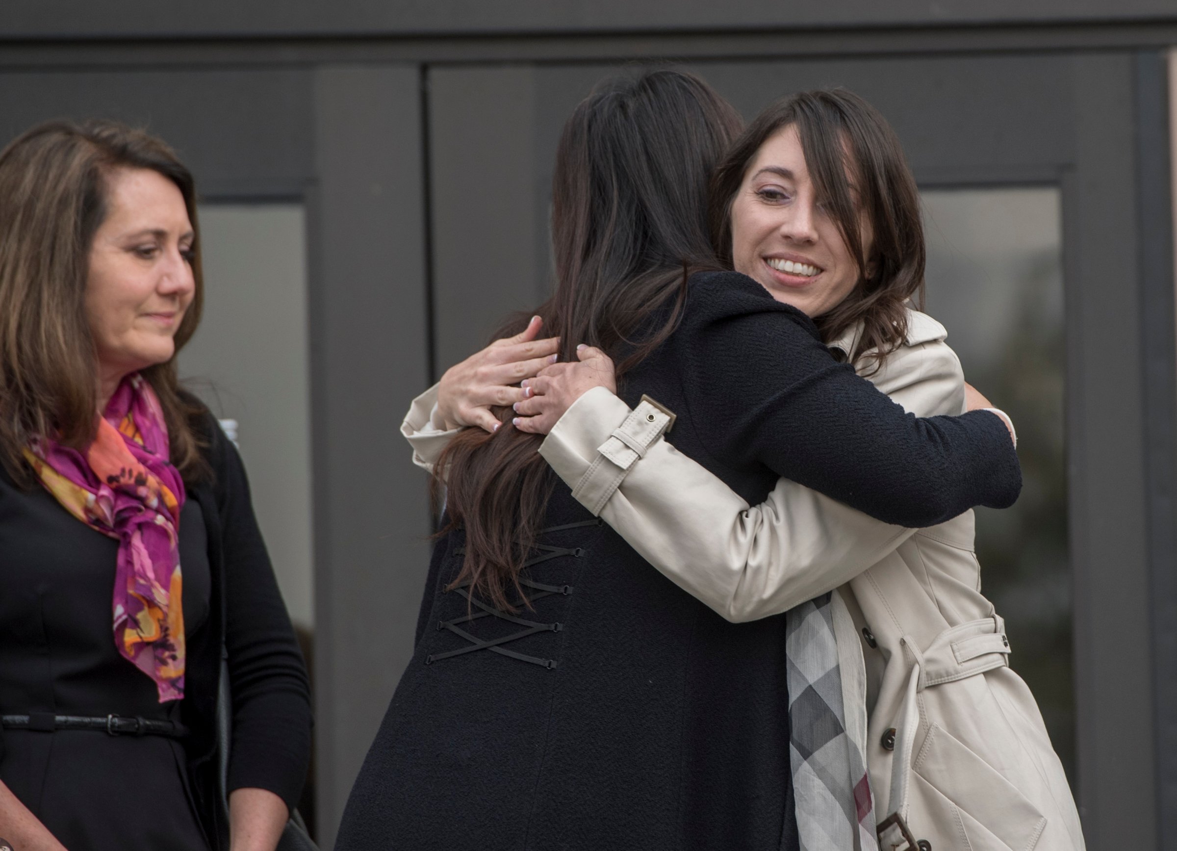 Michelle Susan Hadley, right, hugs Orange County District Attorney Chief of Staff Susan Kang Schroeder after being cleared of all charges in a complicated plot to frame her in Fullerton, Calif., on Jan. 9, 2017.