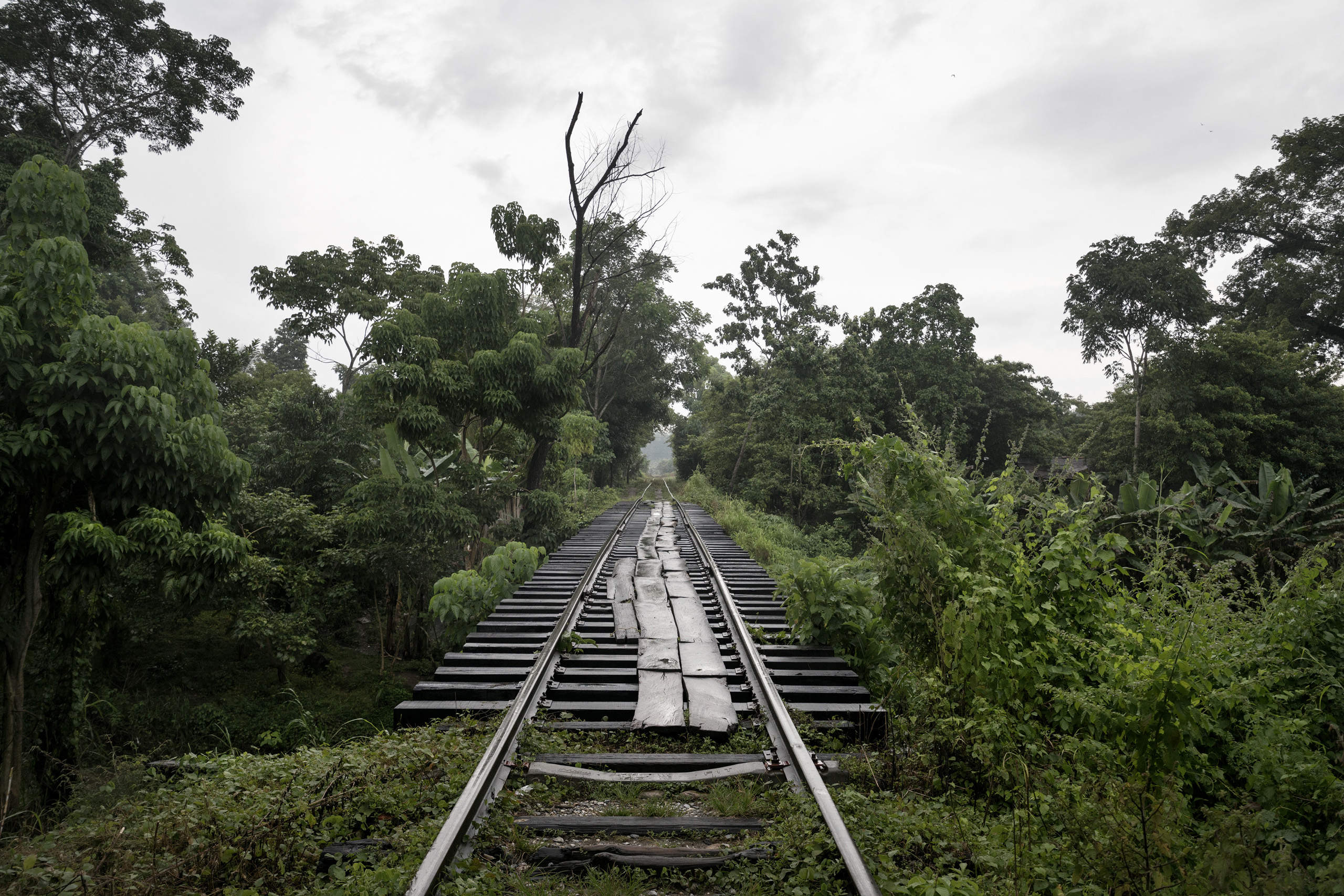 In the outskirts of the Mexican city of Huixtla, in the state of Chiapas, the migrant route that follows the railway tracks and goes from Ciudad Hidalgo, a town on the Mexico / Guatemala border, up to the Mexican city of Ixtepec. Migrants walk on this route for about 400kms until Ixtepec, where they will be able to take the freight train, nicknamed “The Beast” by the migrants because it is extremely dangerous, in order to continue their journey north to the U.S. in a faster way. Chiapas, Mexico. Sept. 25, 2016.