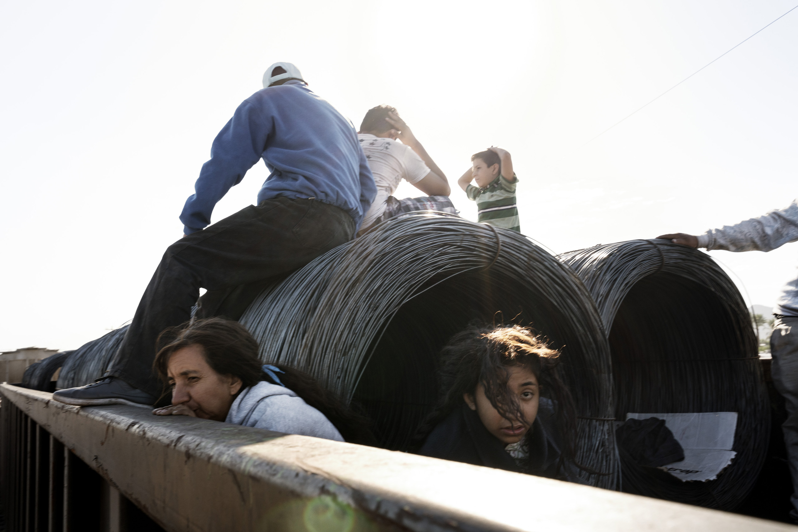 In the town of Caborca, a family of Central American illegal migrants has climbed onto a freight train headed north to the U.S. Sonora, Mexico. Oct. 22, 2016.