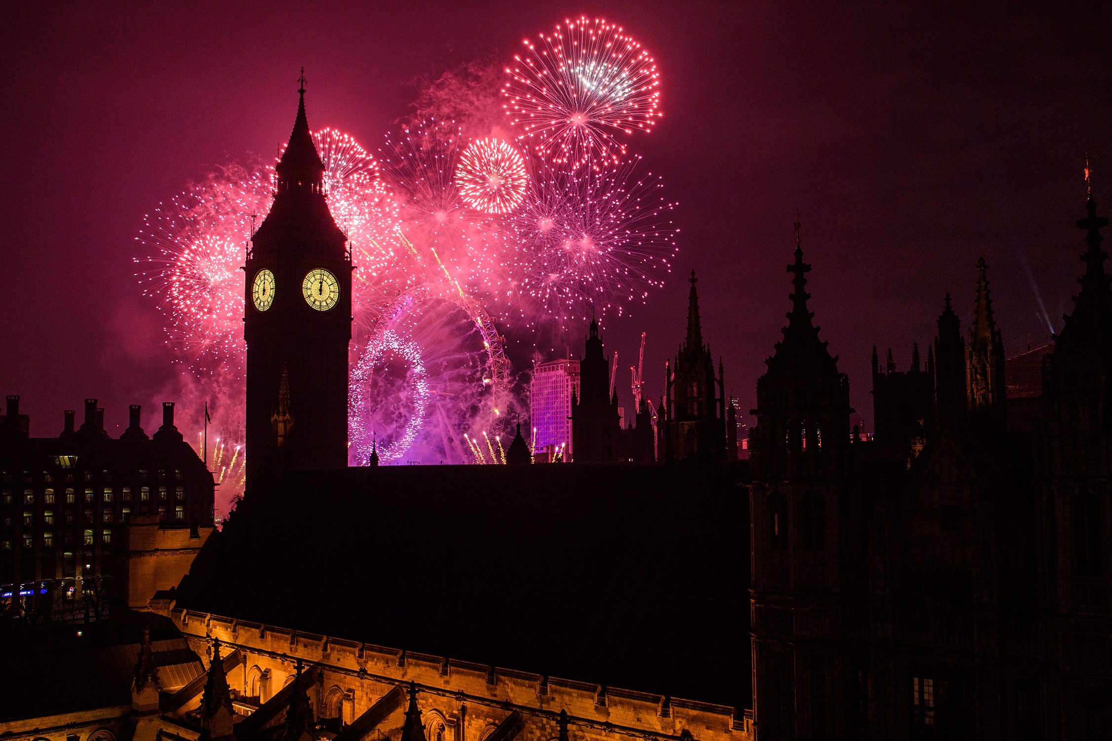 Fireworks light up the London skyline and Big Ben just after midnight on Jan. 1, 2017. (Leon Neal—Getty Images)