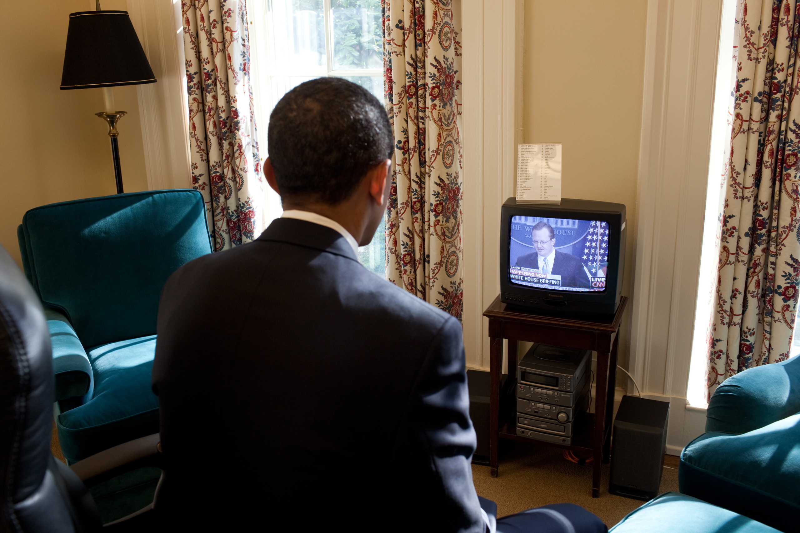 President Obama watches Press Secretary Robert Gibbs' first Press Briefing on television, in his private study off the Oval Office, on Jan. 22, 2009.