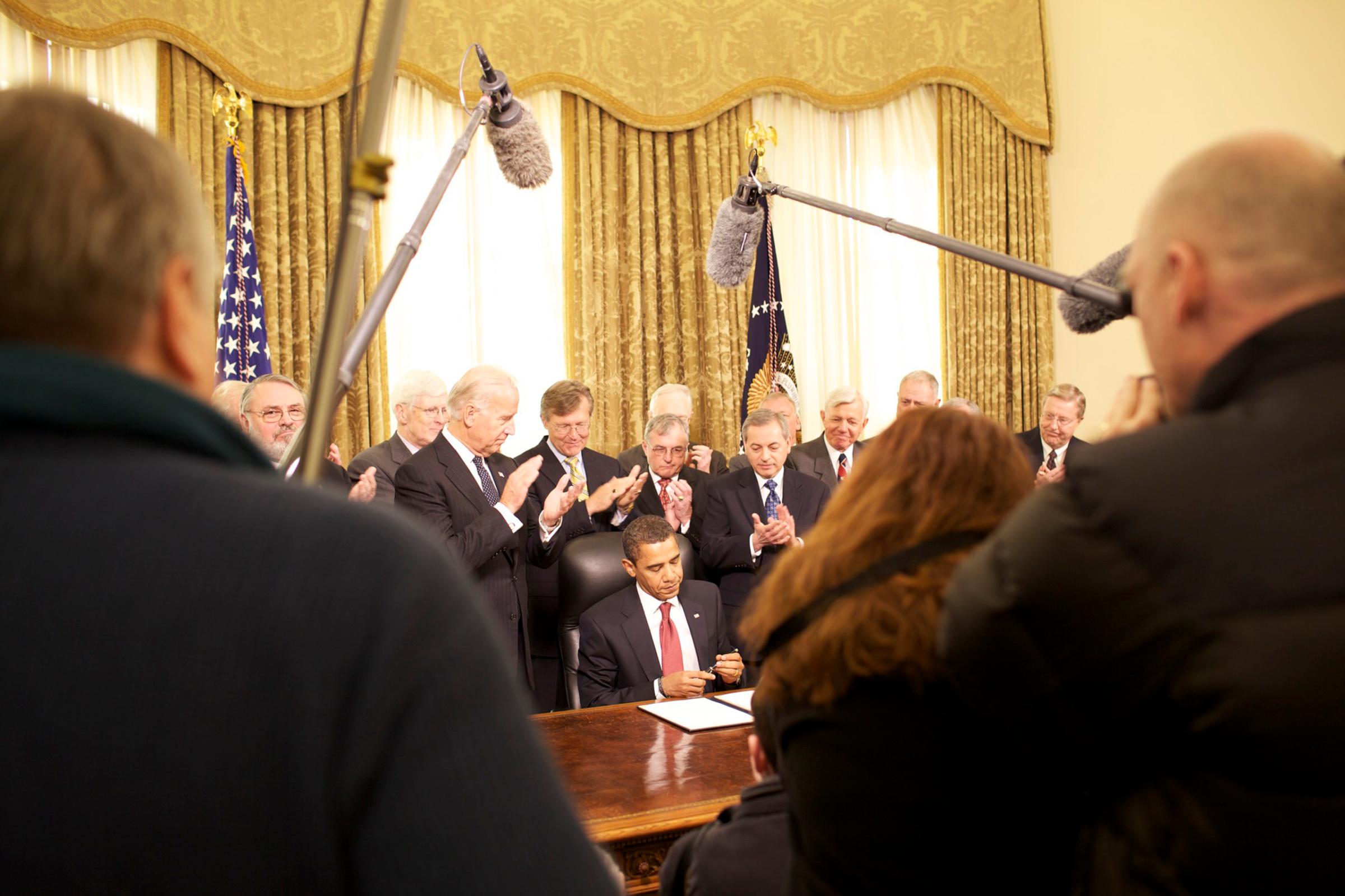 President Barack Obama signs executive orders on  Guantanamo in the Oval Office of the White House, on Jan. 22, 2009.