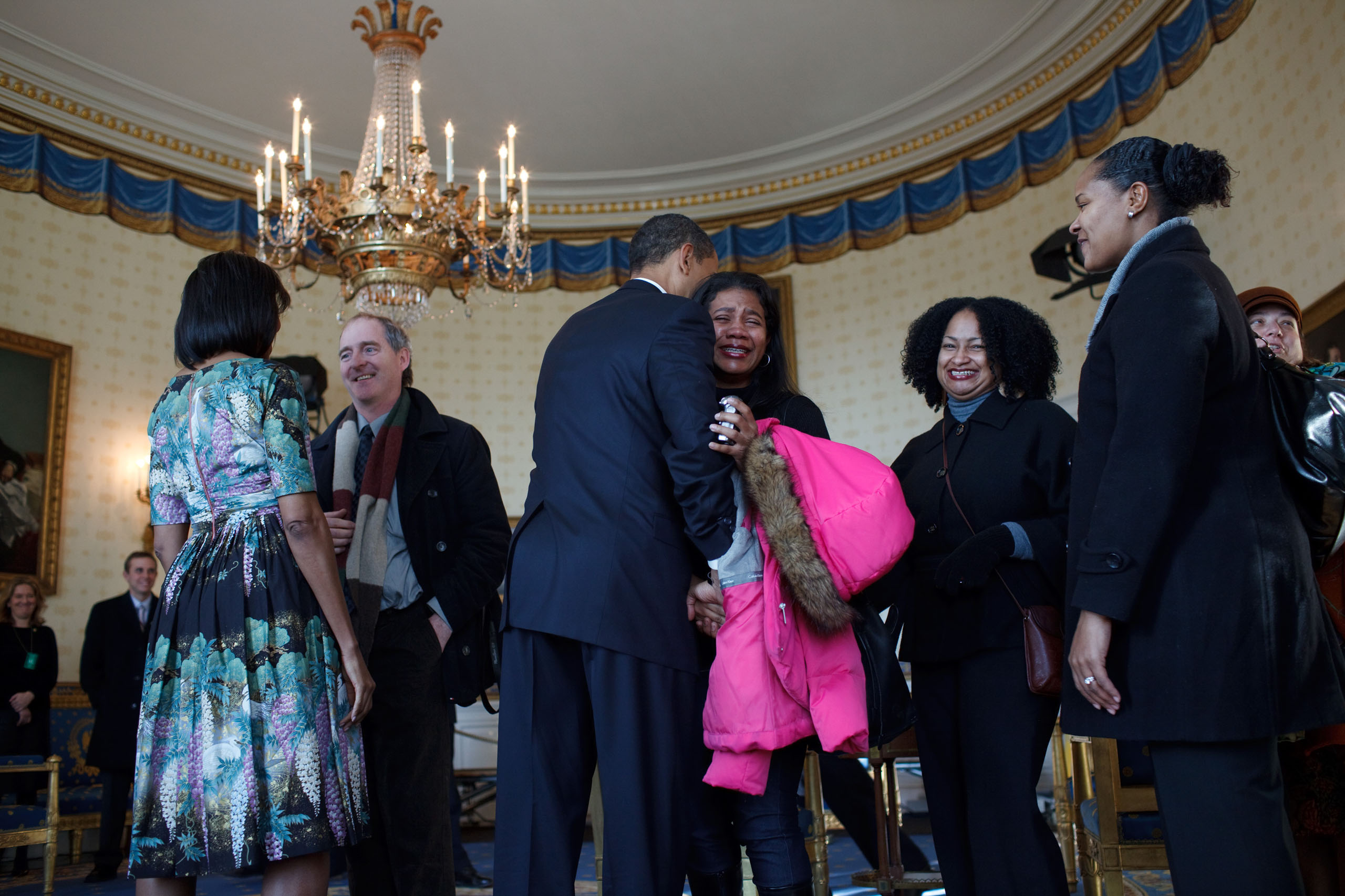 President Barack Obama and First Lady Michelle Obama receive visitors in the Blue Room at the White House, on Jan. 21, 2009.