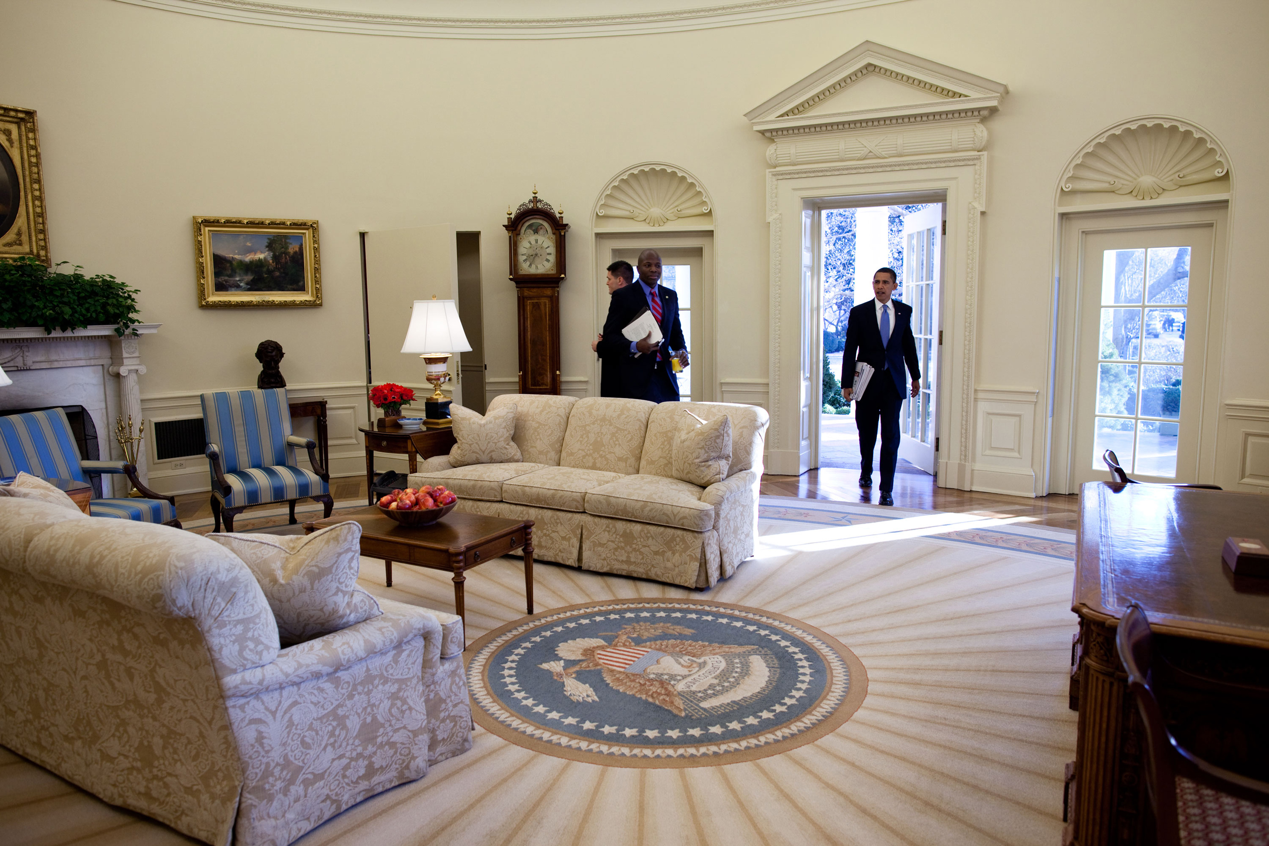 President Barack Obama walks into the Oval Office at the White House for his first full day in office on Jan. 21, 2009.
