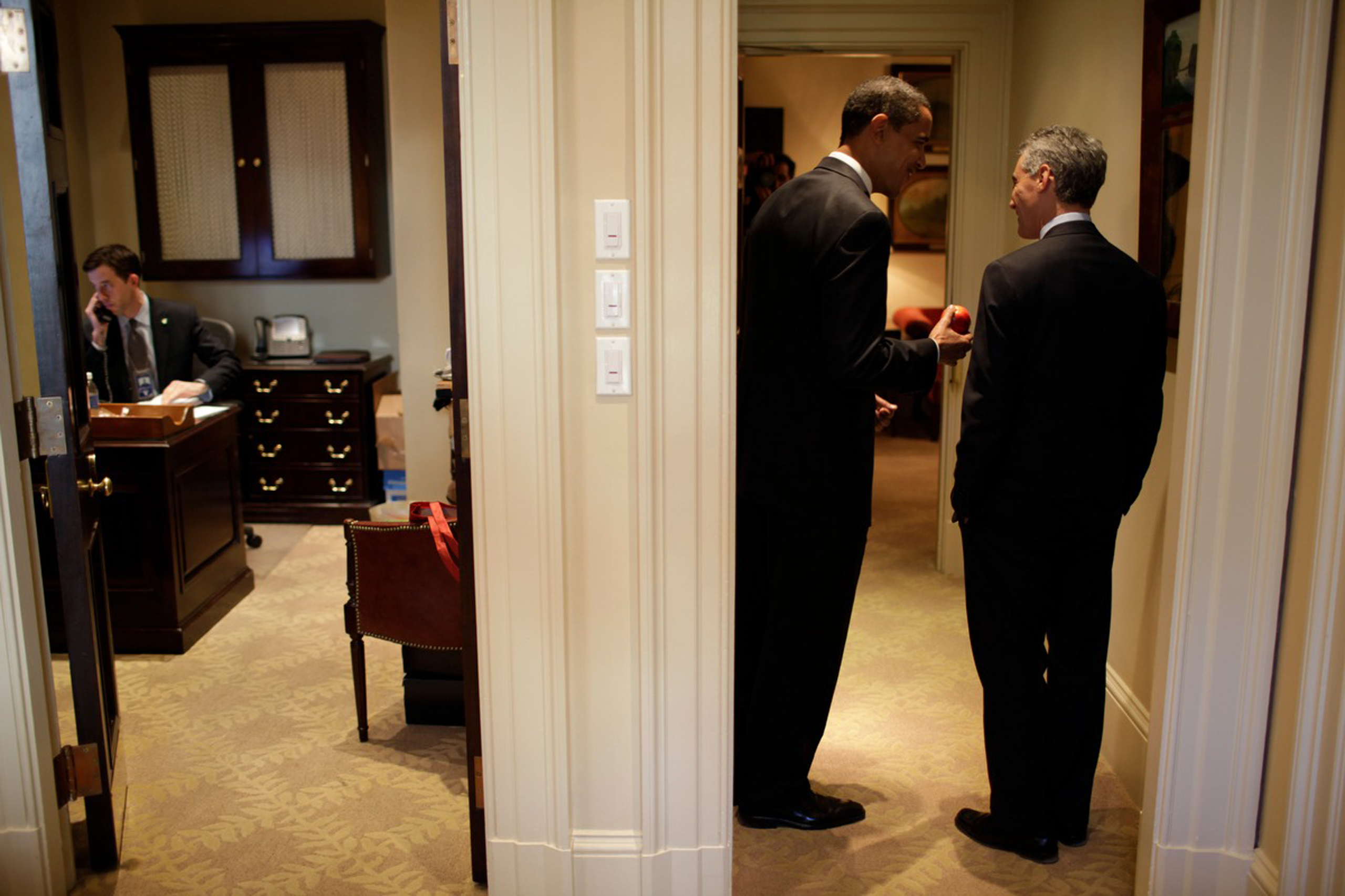 President Barack Obama talks to Chief of Staff Rahm Emmanuel in the Outer Oval Office of the White House, on Jan. 21, 2009.