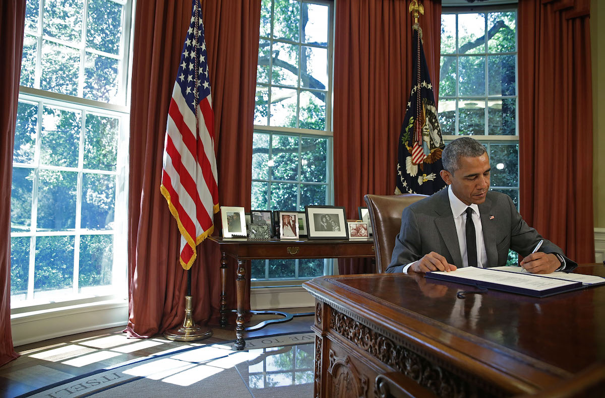 President Obama Signs Bill In Oval Office